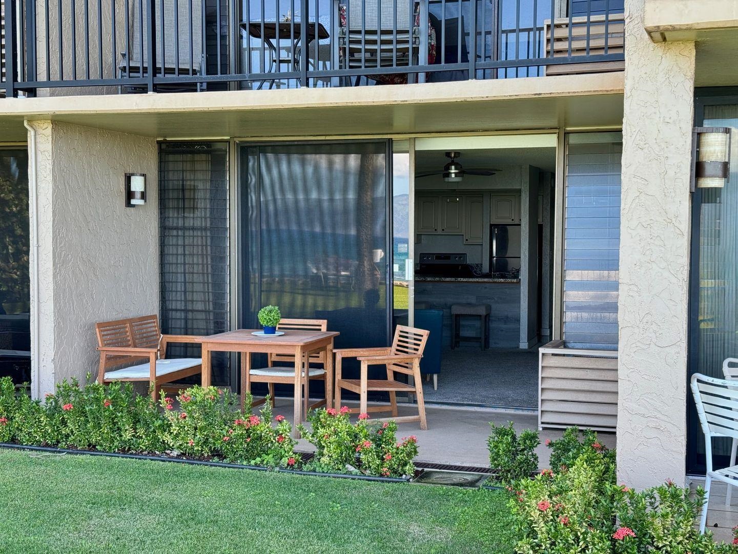 3543 Lower Honoapiilani Road, Unit A107 Lahaina, HI 96761 - Photo 3 of 19 a backyard of a house with outdoor seating