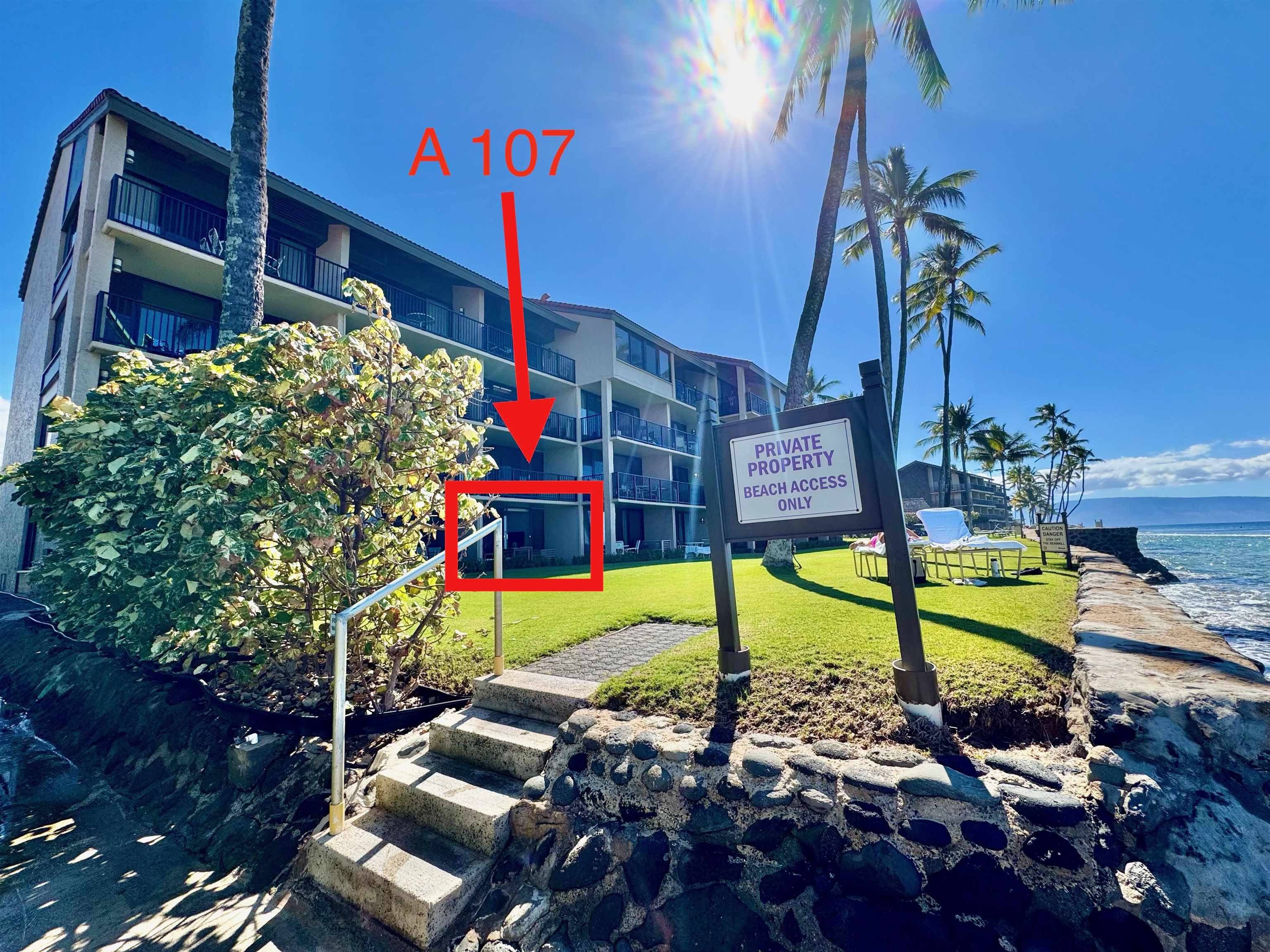 3543 Lower Honoapiilani Road, Unit A107 Lahaina, HI 96761 - Photo 4 of 19 a view of an chairs and potted plants