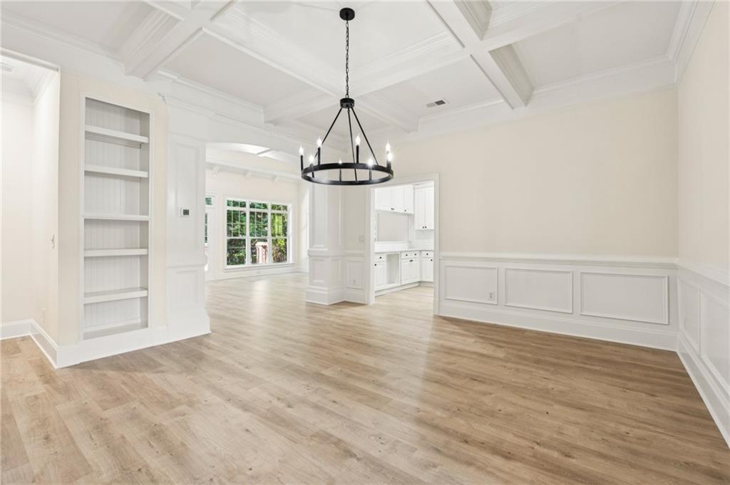 1950 Buford Dam Road, Unit 801 Cumming, GA 30041 - Photo 11 of 26 a view of empty room with wooden floor and windows