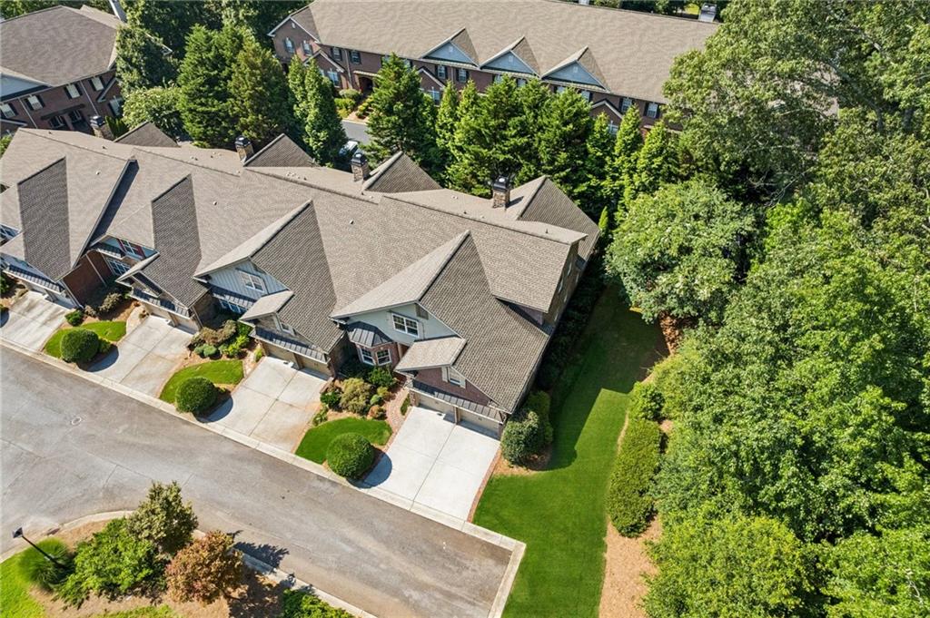 1950 Buford Dam Road, Unit 801 Cumming, GA 30041 - Photo 6 of 26 an aerial view of a house with swimming pool and garden