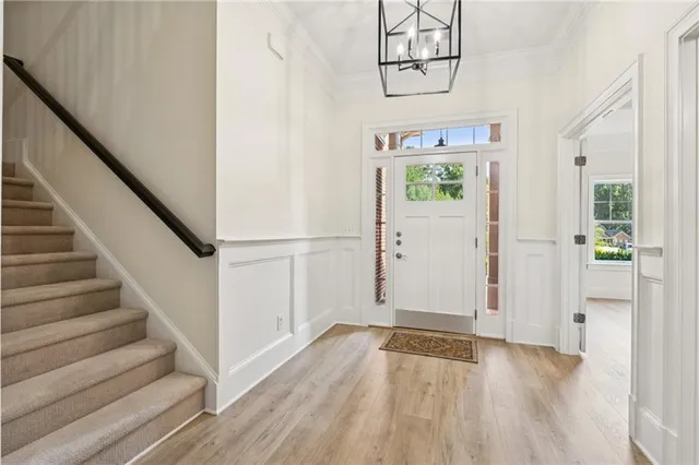a view of entryway with wooden floor