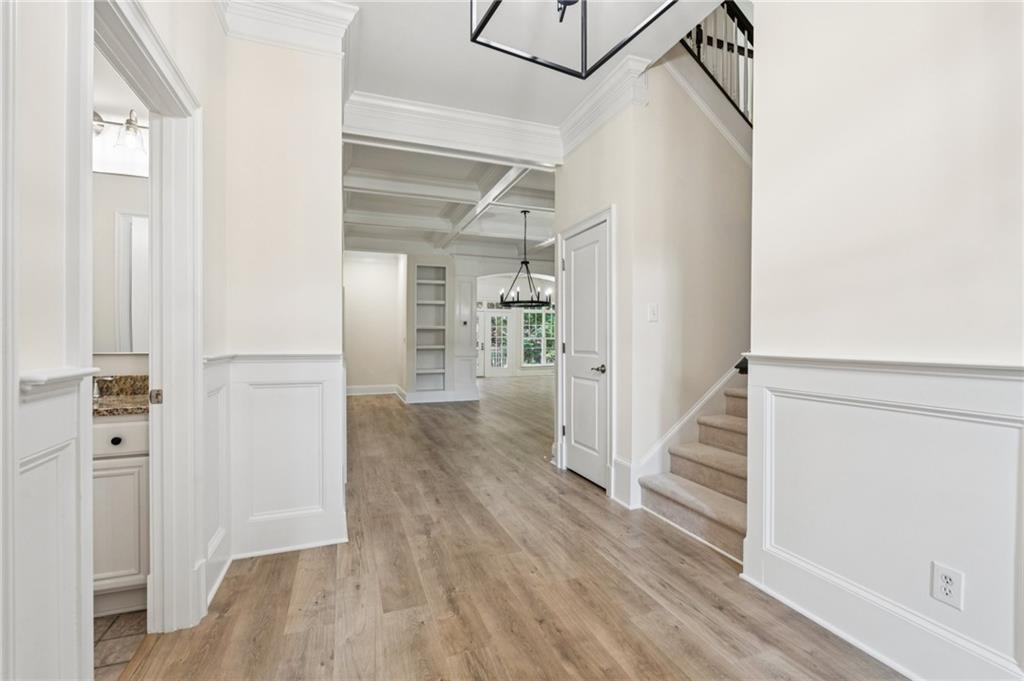 1950 Buford Dam Road, Unit 801 Cumming, GA 30041 - Photo 9 of 26 a view of a hallway with wooden floor and entryway