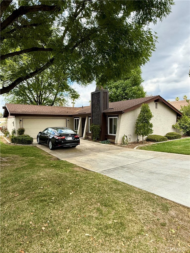 1060 Ardmore Circle Redlands, CA 92374 - Photo 1 of 1 a car parked in front of a house