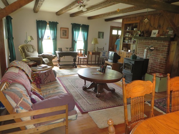 13 West Branch Road Heath, MA 01340 - Photo 14 of 28 a living room with furniture and a fireplace