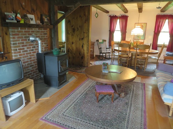 13 West Branch Road Heath, MA 01340 - Photo 15 of 28 a dining room with couches chairs and a coffee table