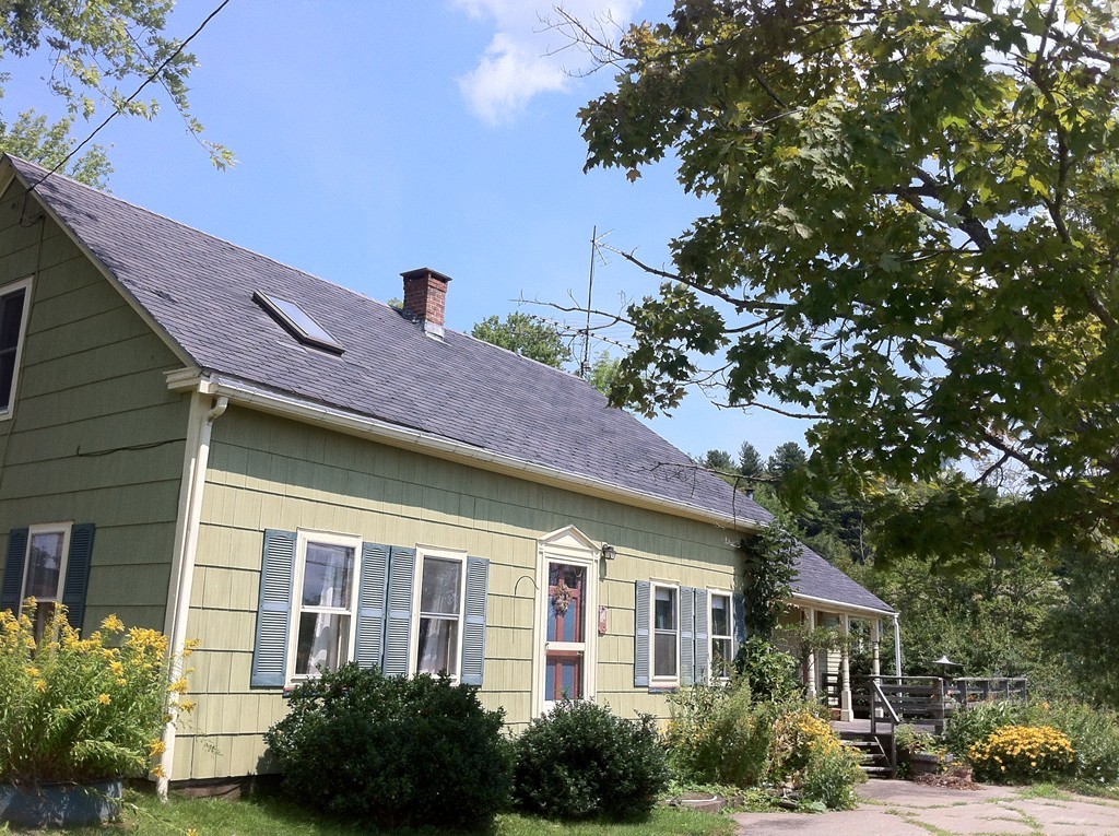 13 West Branch Road Heath, MA 01340 - Photo 2 of 28 a front view of a house with garden