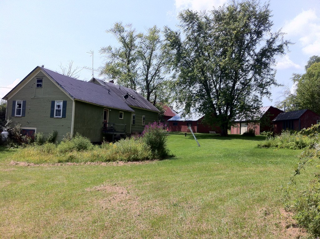 13 West Branch Road Heath, MA 01340 - Photo 24 of 28 a front view of a house with a garden