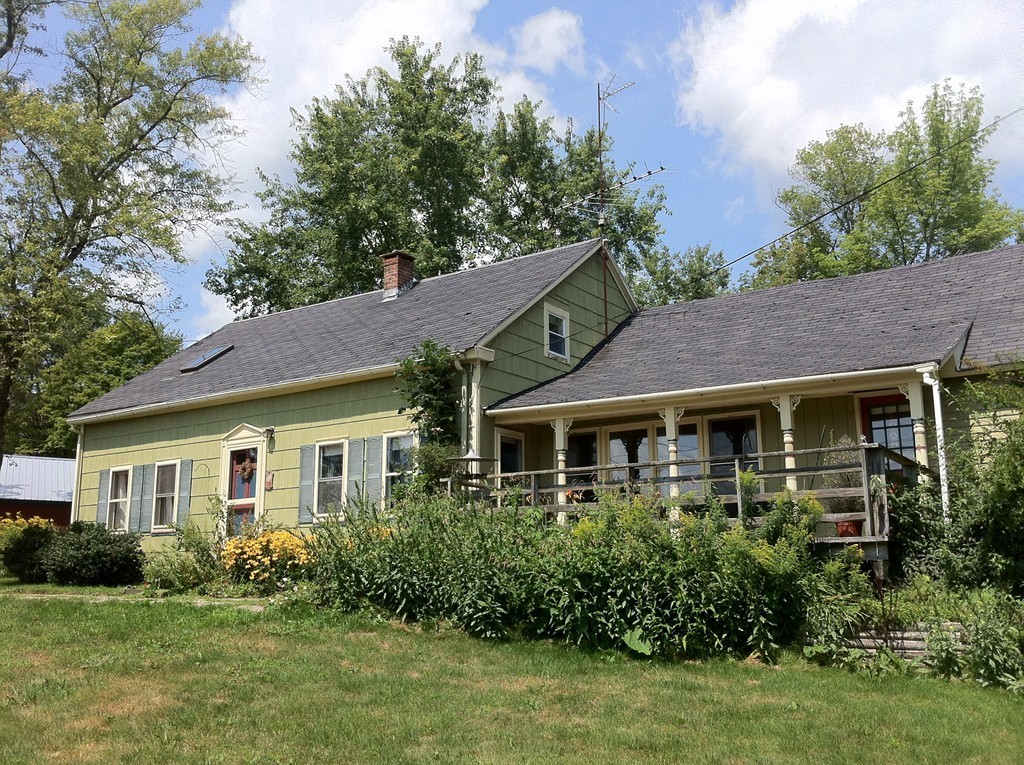 13 West Branch Road Heath, MA 01340 - Photo 3 of 28 a front view of a house with a yard and green space