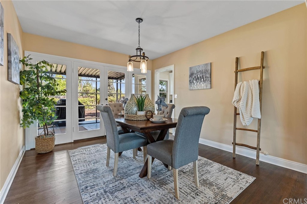 3931 Terracina Drive Riverside, CA 92506 - Photo 1 of 1 a view of a dining room with furniture window and wooden floor