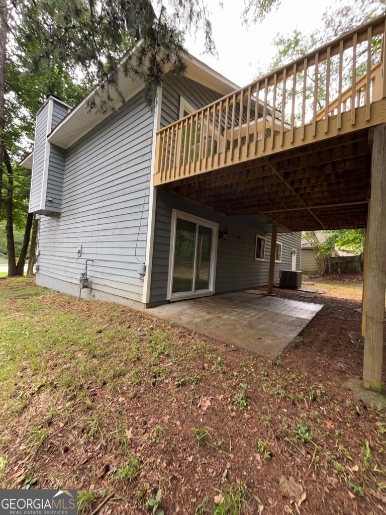 1265 Herrington Road Lawrenceville, GA 30044 - Photo 47 of 52 a view of a house with a yard