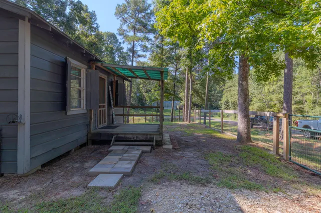 a view of a yard with trees