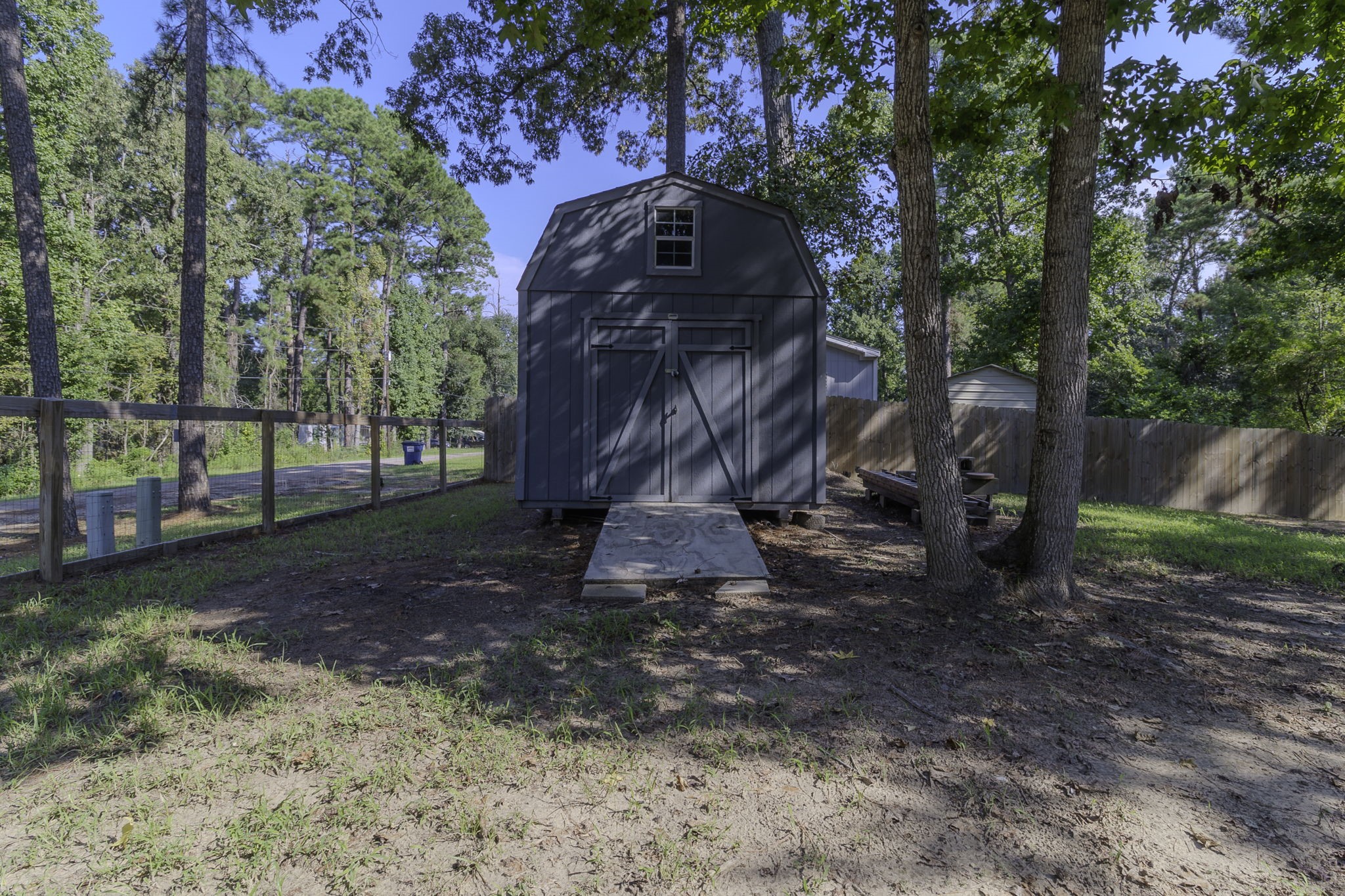 126 Pine Ridge Onalaska, TX 77360 - Photo 14 of 16 a view of a yard in a yard
