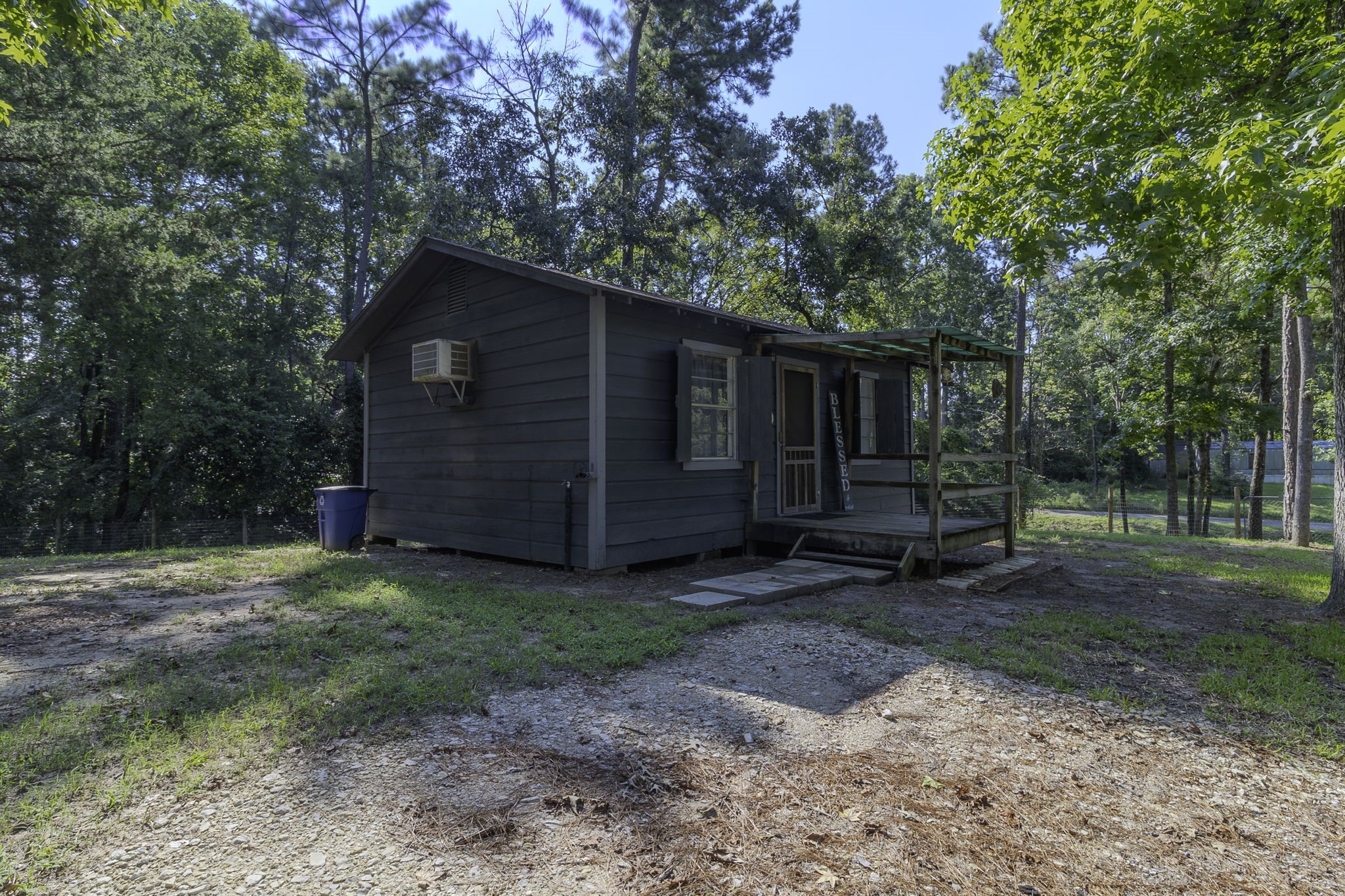 126 Pine Ridge Onalaska, TX 77360 - Photo 15 of 16 a view of backyard with wooden fence and a large tree
