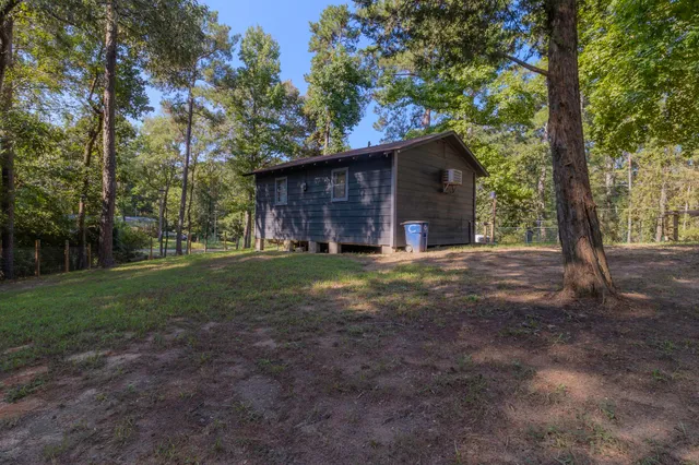 a view of a house with yard and tree s