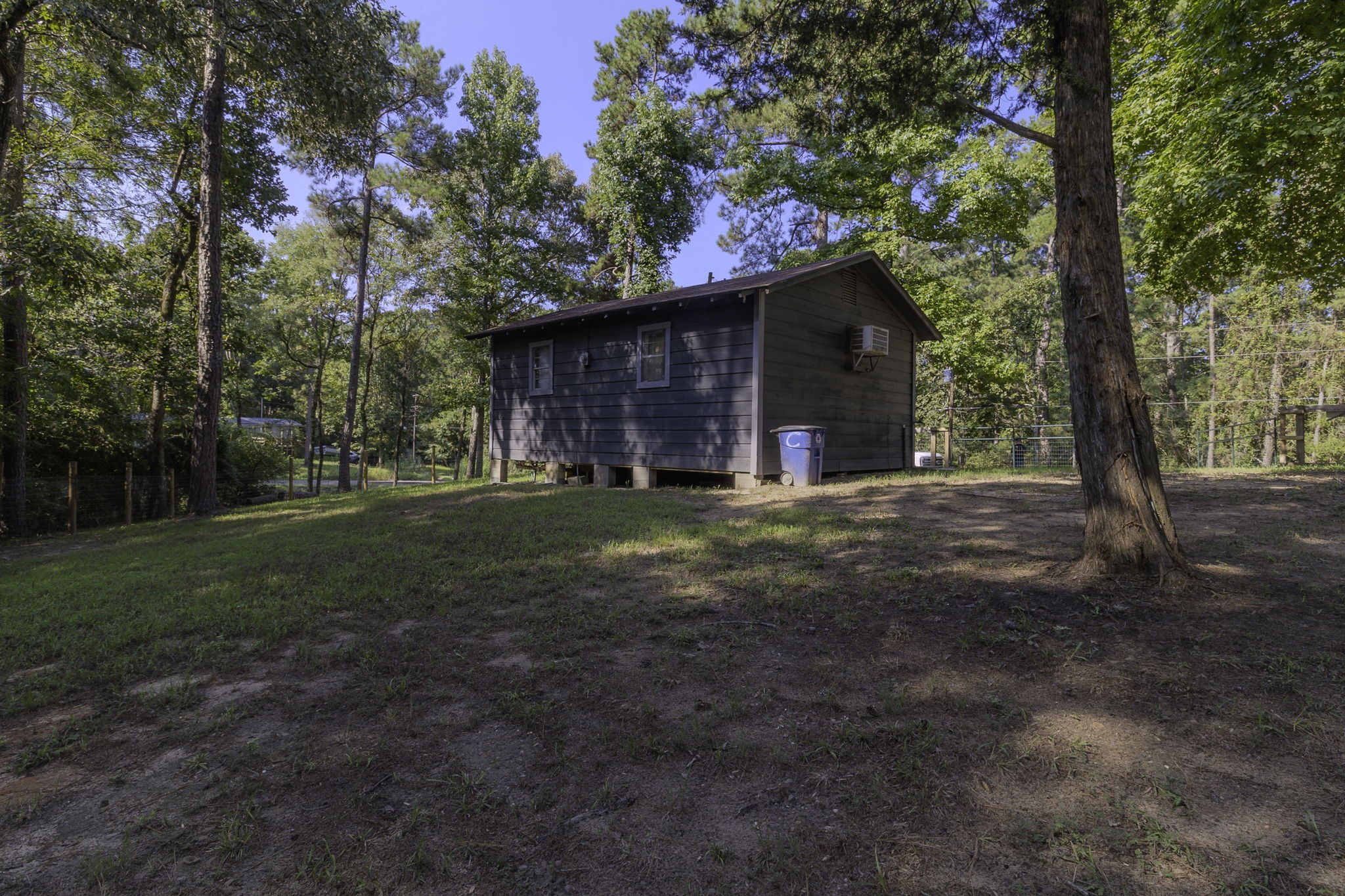 126 Pine Ridge Onalaska, TX 77360 - Photo 16 of 16 a view of a house with yard and tree s