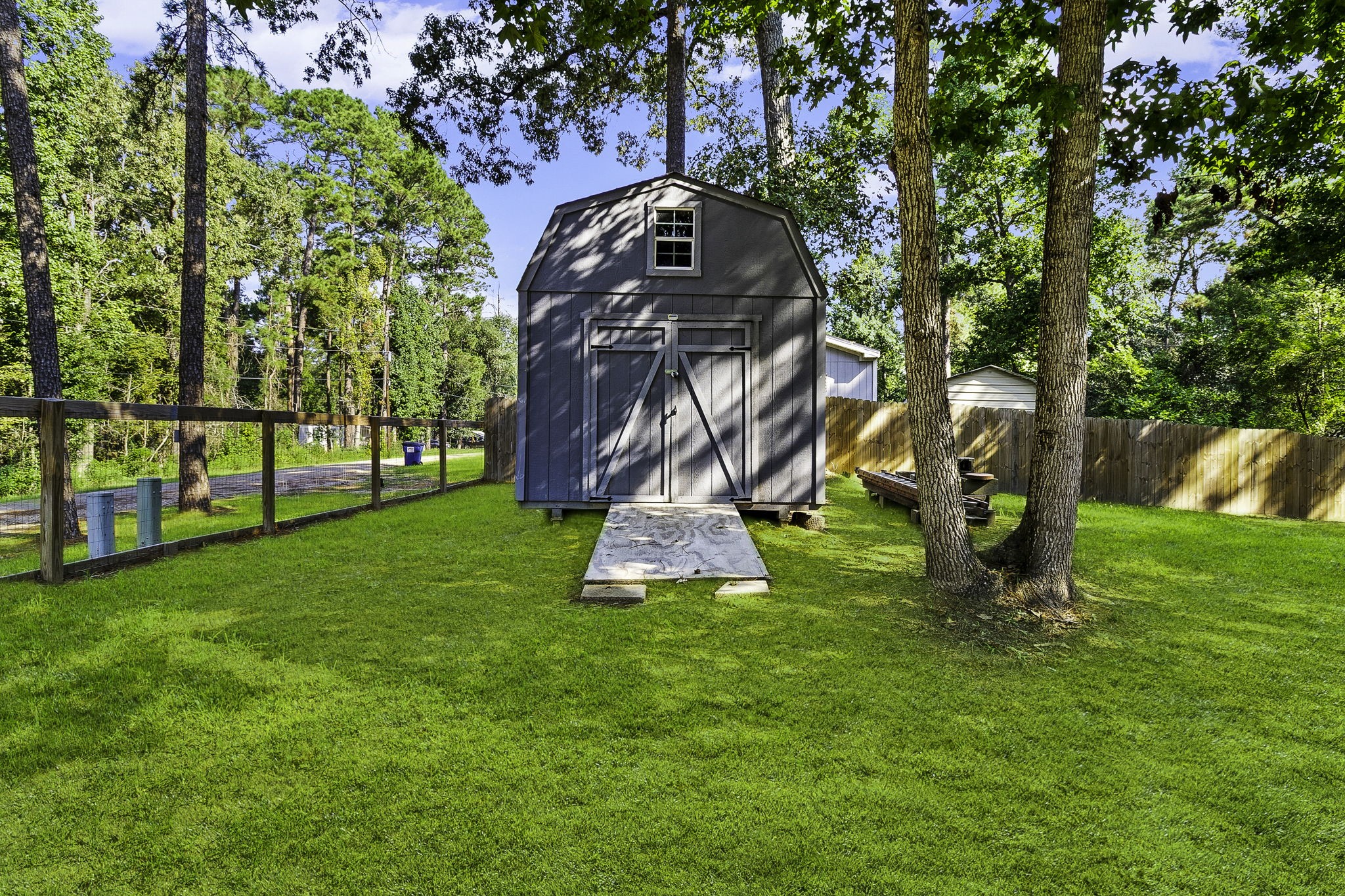 126 Pine Ridge Onalaska, TX 77360 - Photo 3 of 16 a view of a park with a slide