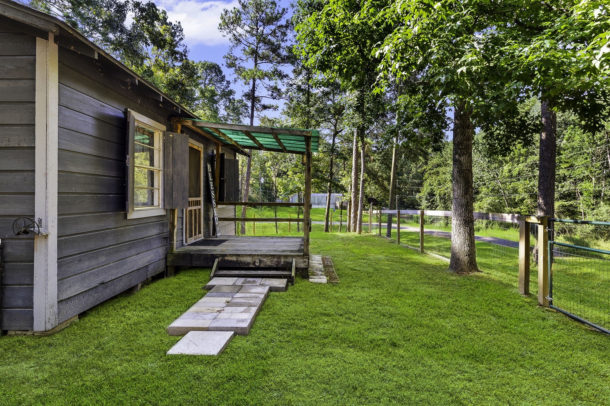 126 Pine Ridge Onalaska, TX 77360 - Photo 4 of 16 a view of a back yard with a house