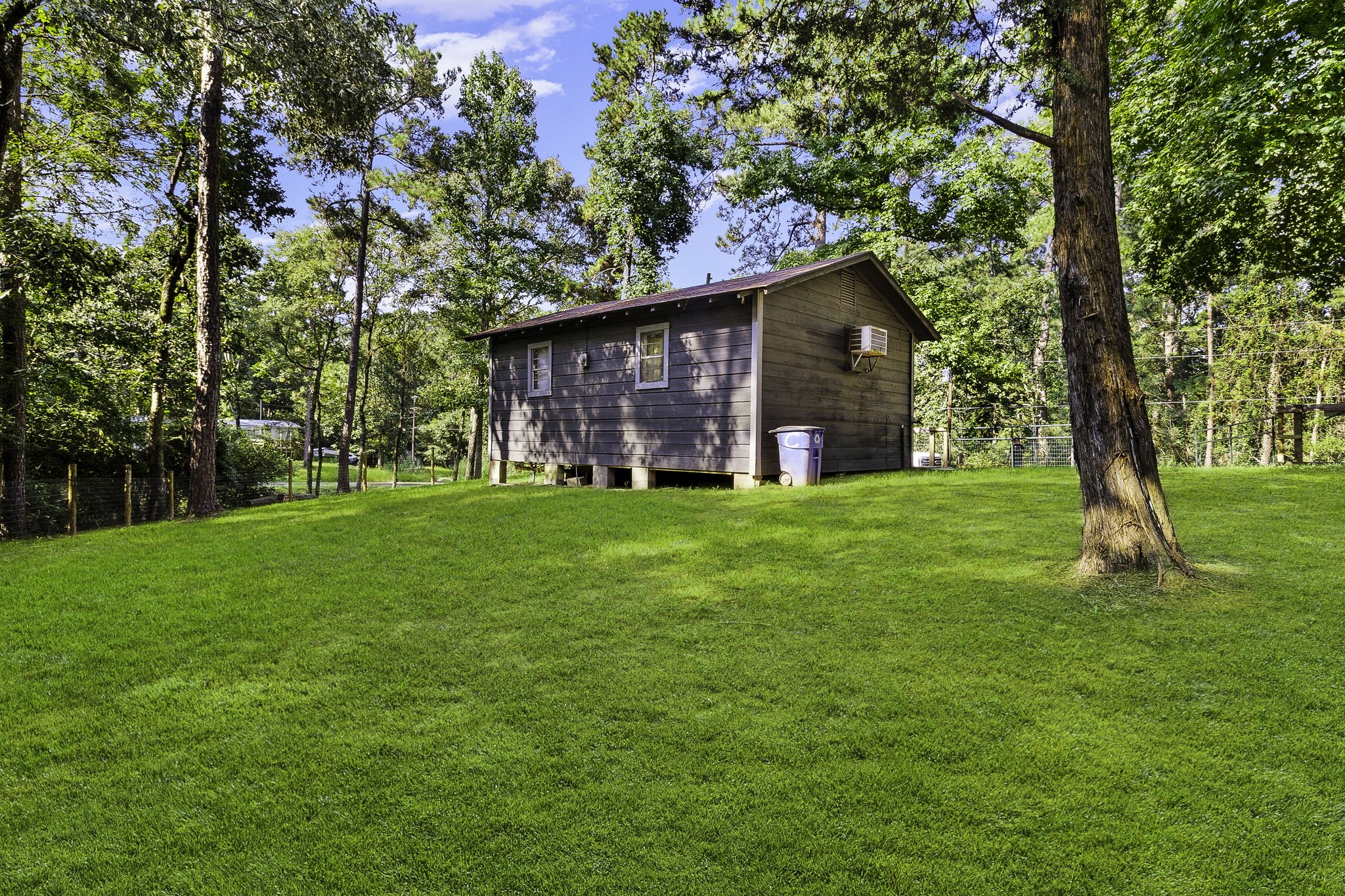 126 Pine Ridge Onalaska, TX 77360 - Photo 5 of 16 a view of a house with a yard