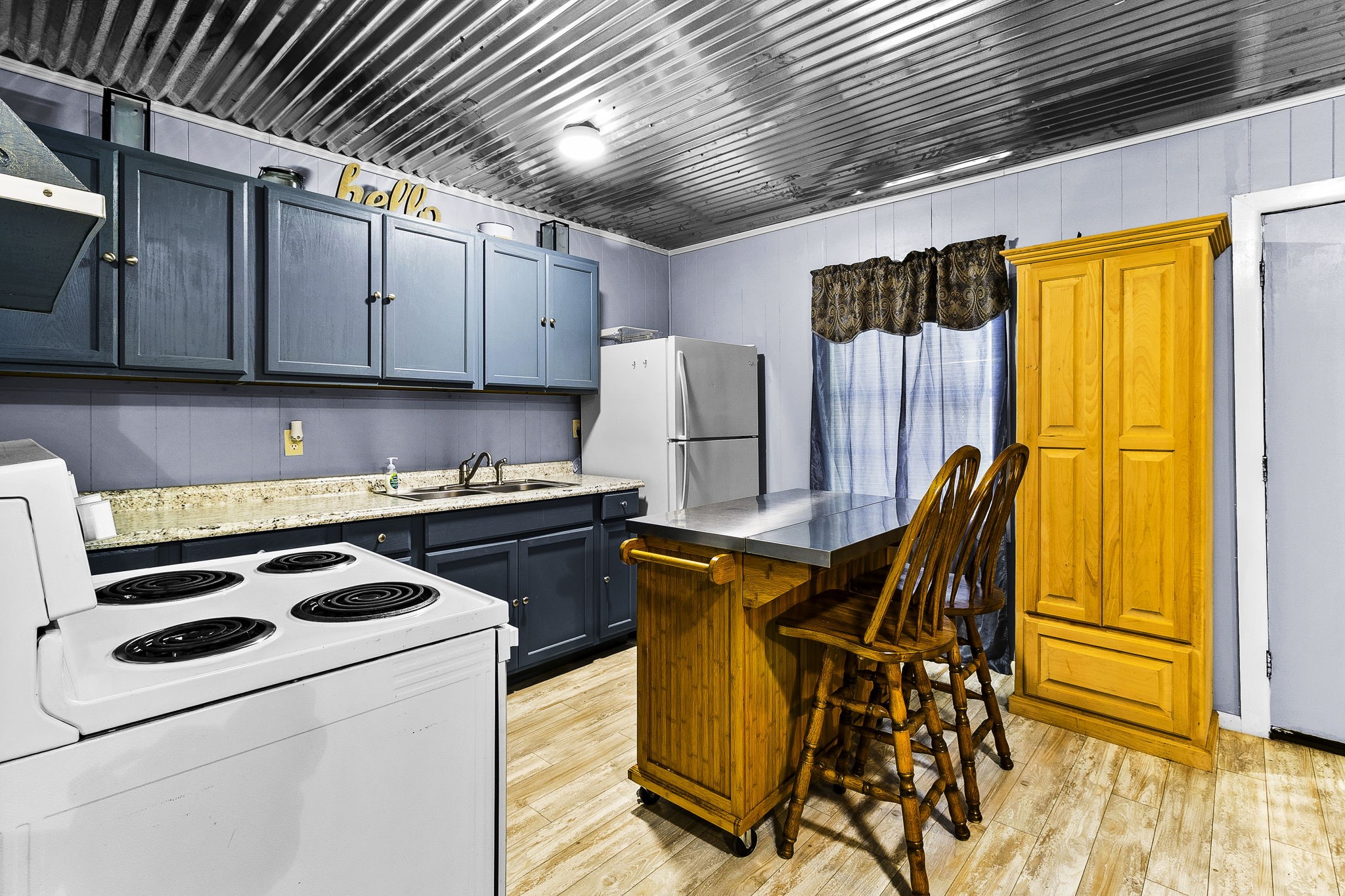 126 Pine Ridge Onalaska, TX 77360 - Photo 6 of 16 a kitchen with stainless steel appliances granite countertop a stove a sink dishwasher and a refrigerator with wooden cabinets