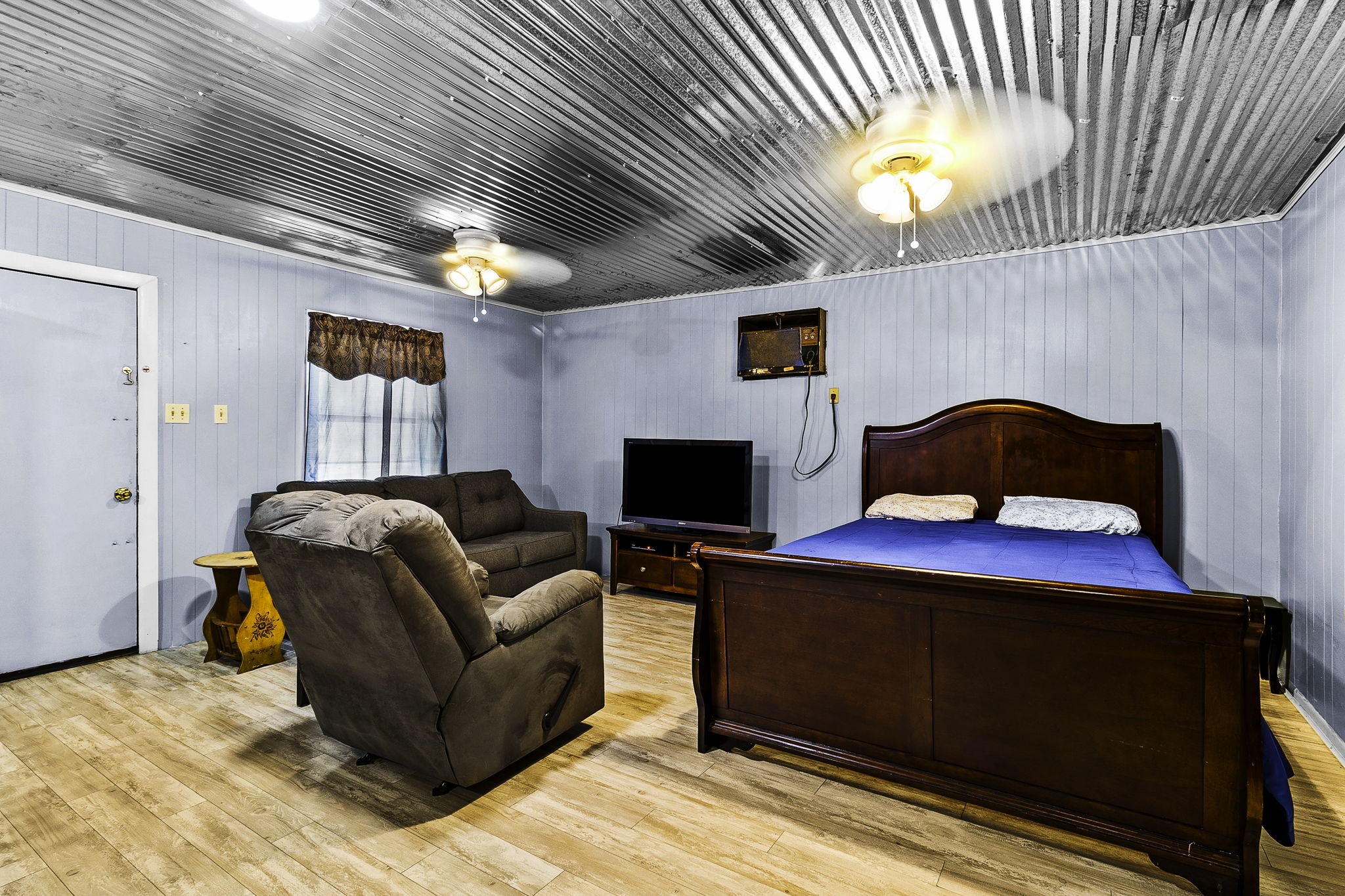 126 Pine Ridge Onalaska, TX 77360 - Photo 7 of 16 a living room with furniture and a flat screen tv