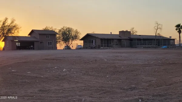 a view of a terrace with a table and chairs