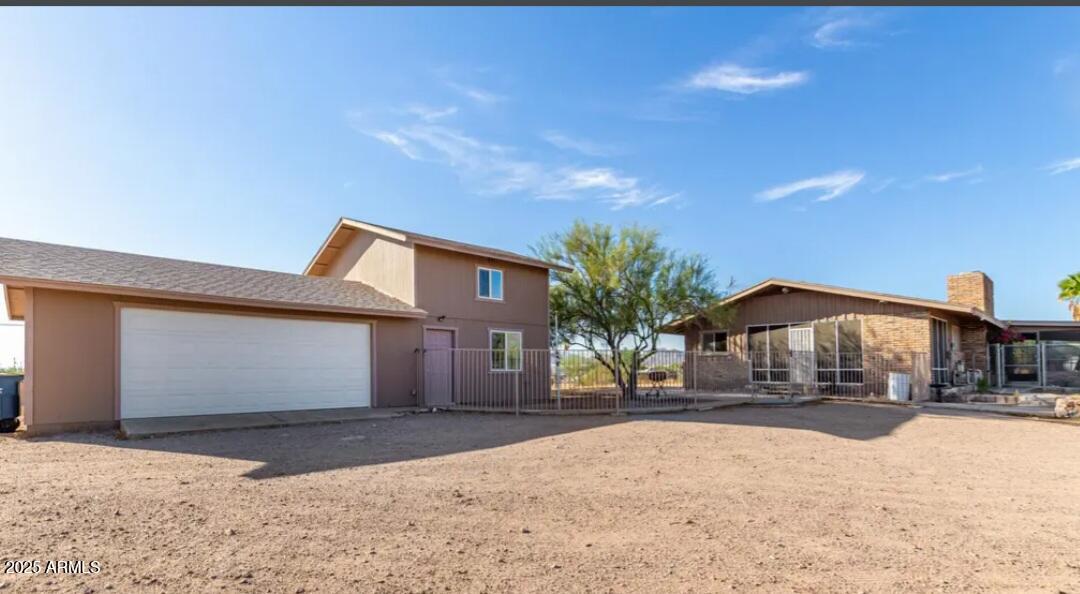 522 South Cortez Road Apache Junction, AZ 85119 - Photo 13 of 48 a front view of a house with a yard and covered with snow