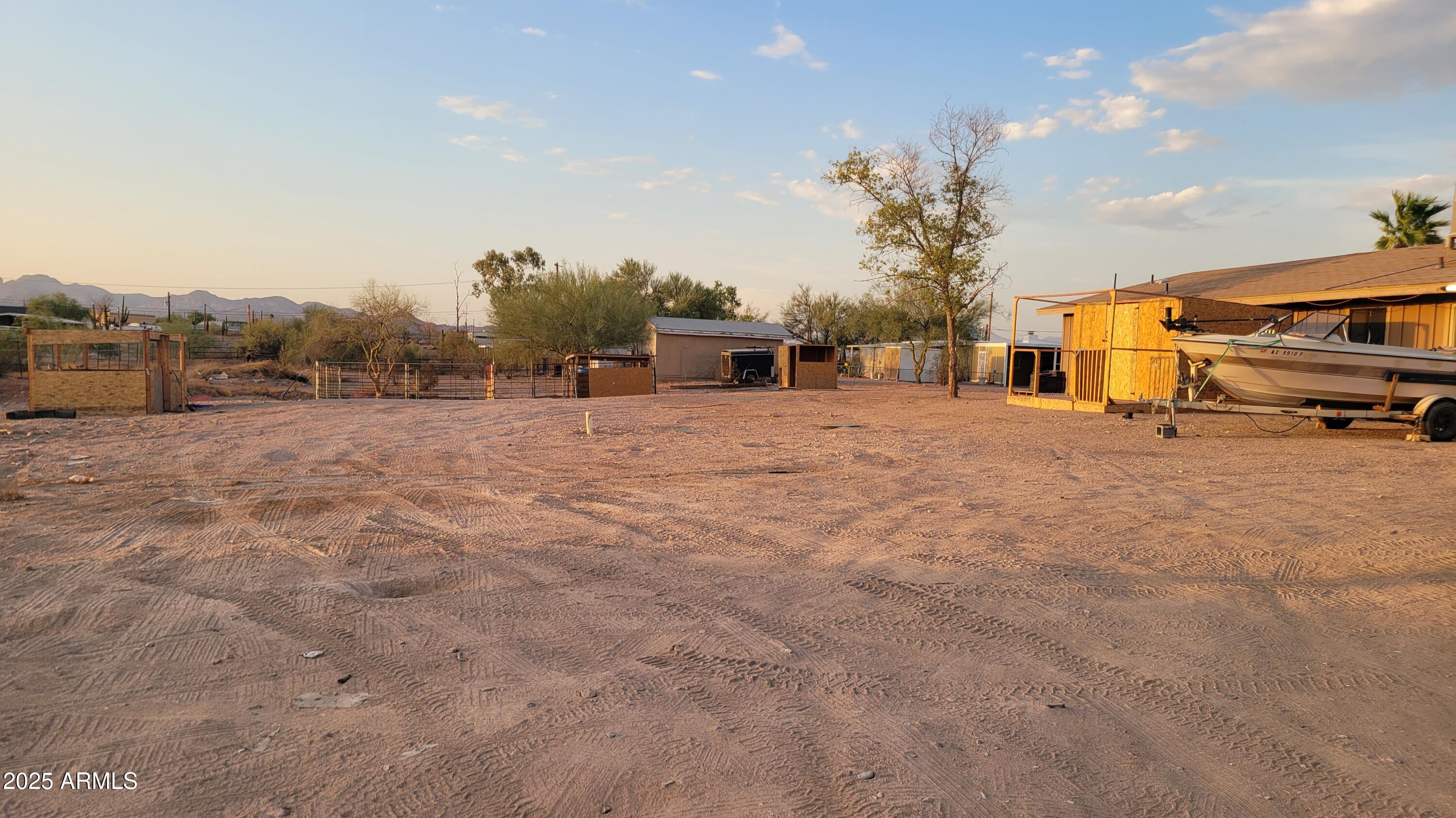 522 South Cortez Road Apache Junction, AZ 85119 - Photo 18 of 48 a backyard of a house with table and chairs