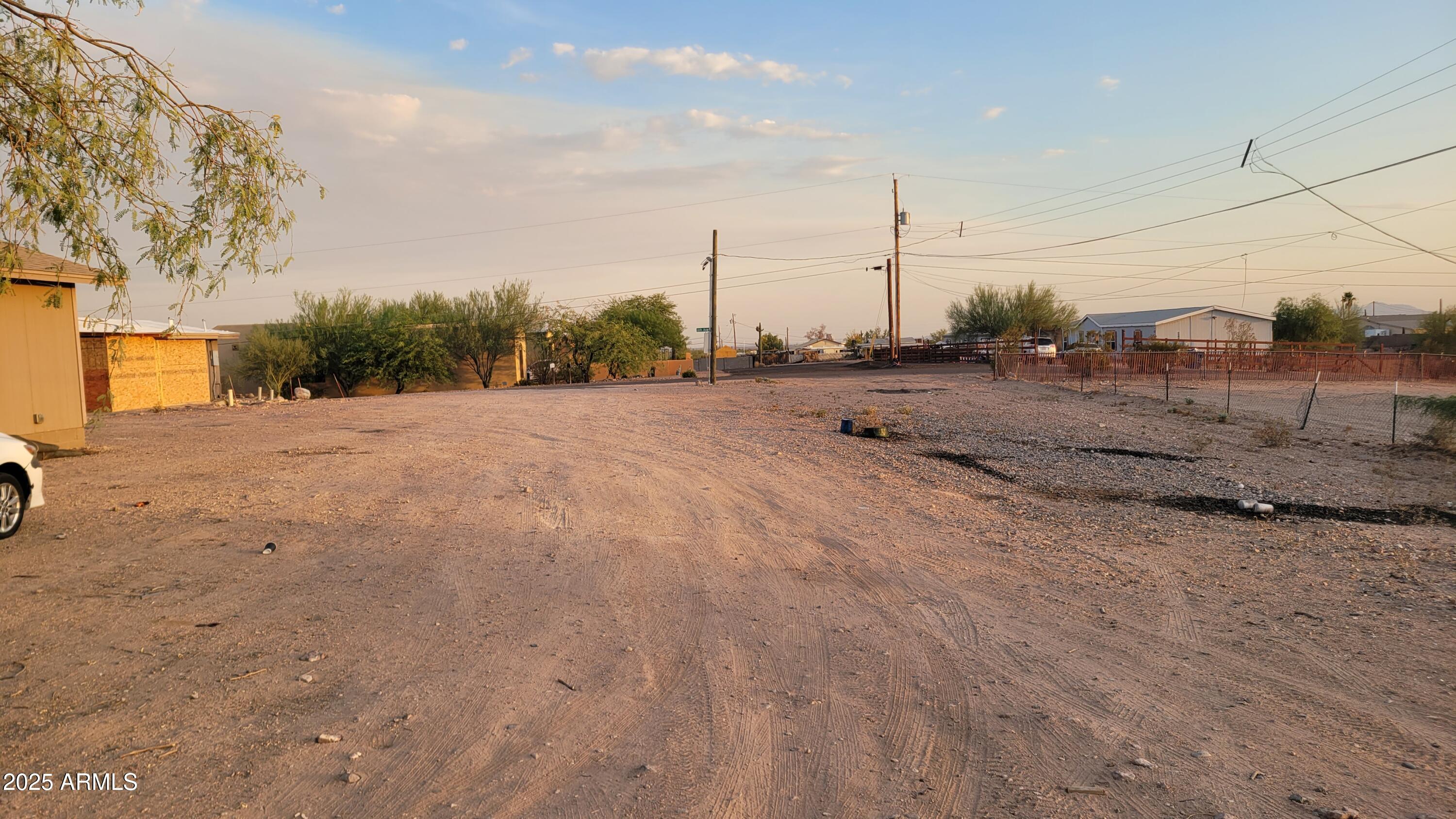 522 South Cortez Road Apache Junction, AZ 85119 - Photo 19 of 48 a view of a dry yard with a tree