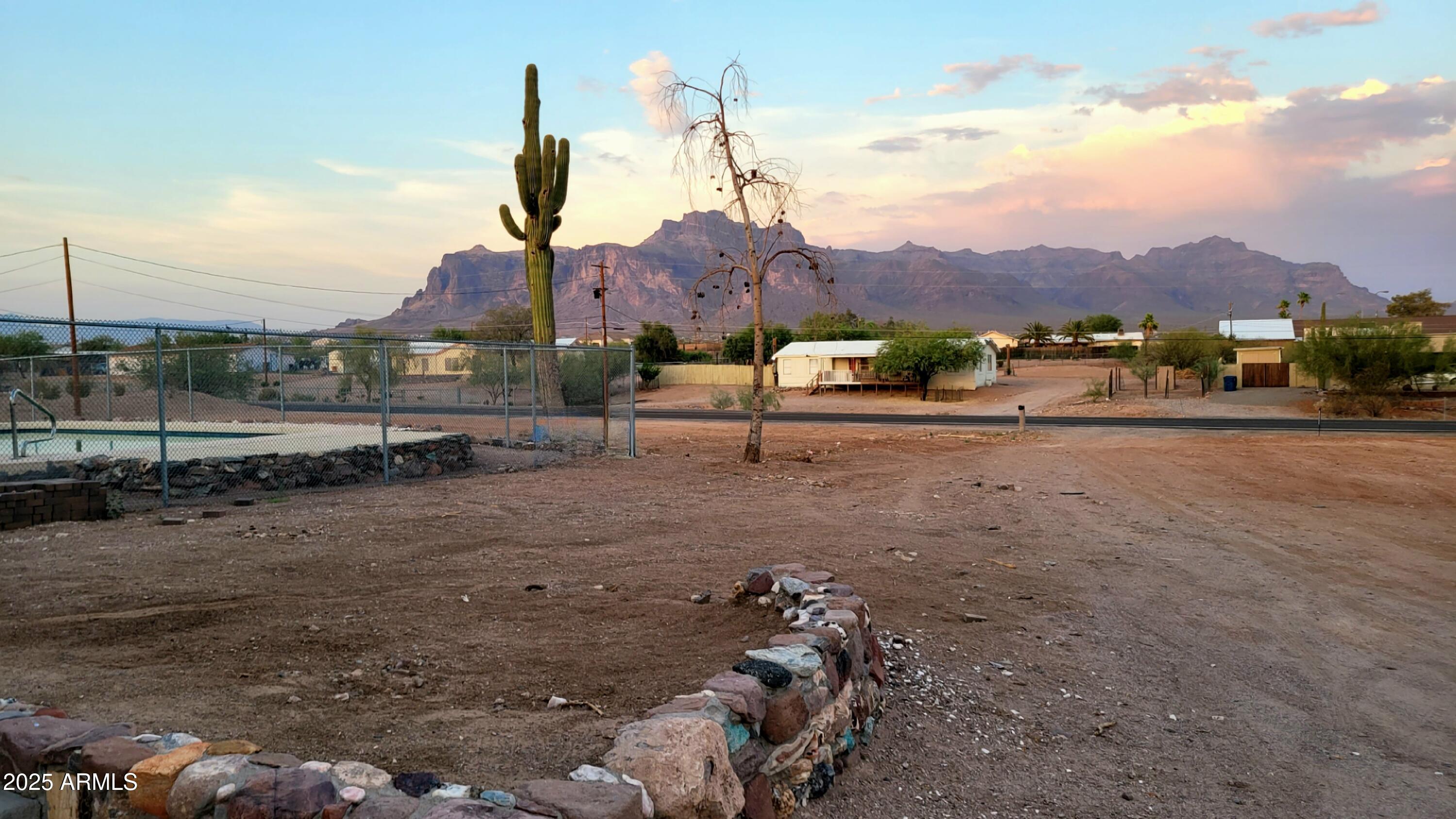 522 South Cortez Road Apache Junction, AZ 85119 - Photo 23 of 48 a view of a house with a yard and sitting area