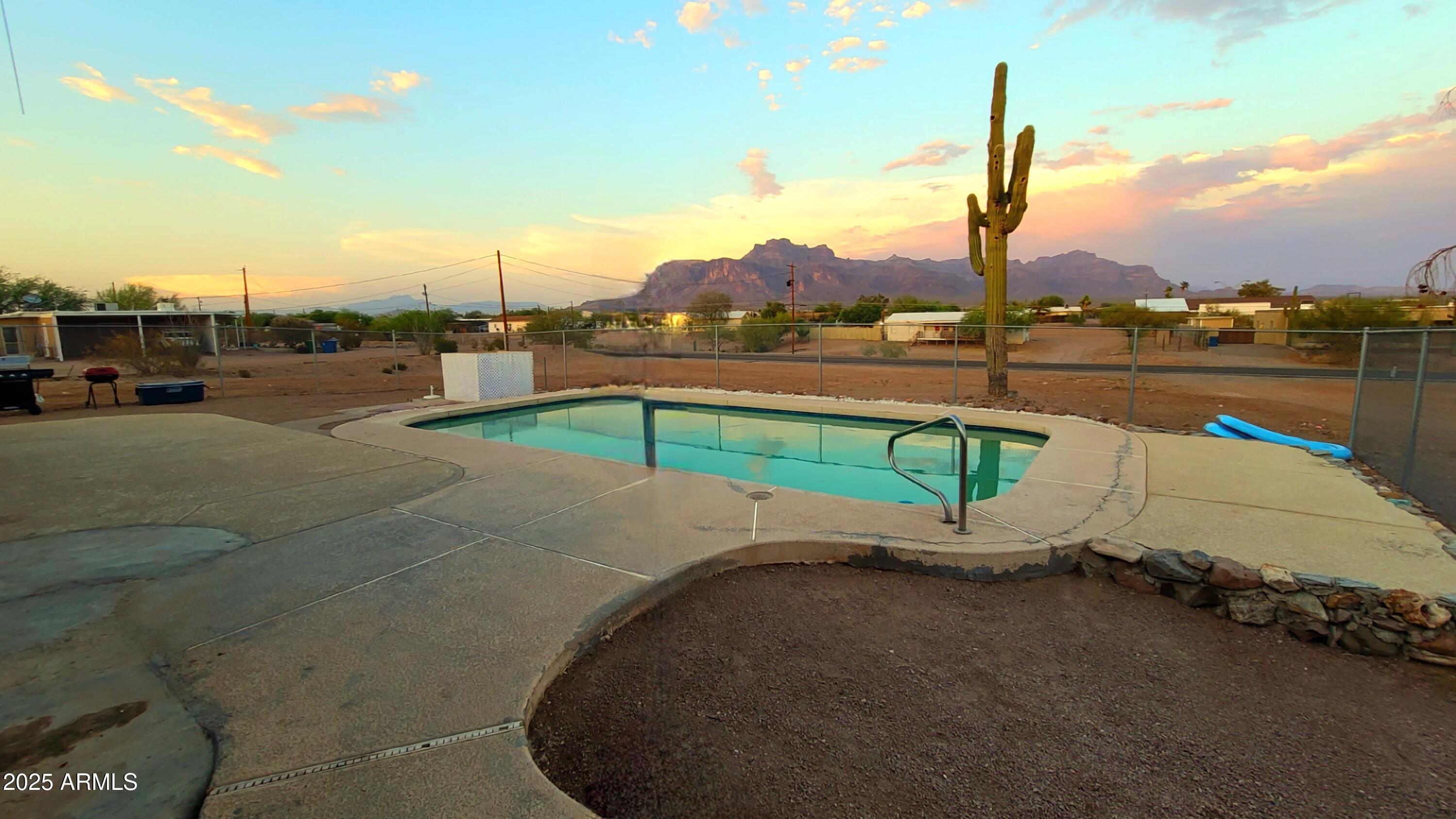 522 South Cortez Road Apache Junction, AZ 85119 - Photo 26 of 48 a view of a lake with a table and chairs