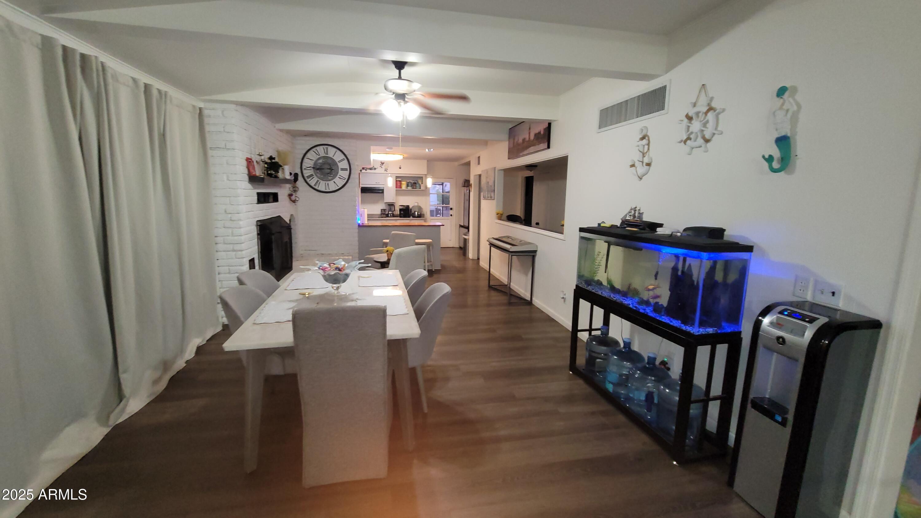 522 South Cortez Road Apache Junction, AZ 85119 - Photo 33 of 48 a living room with furniture and a chandelier