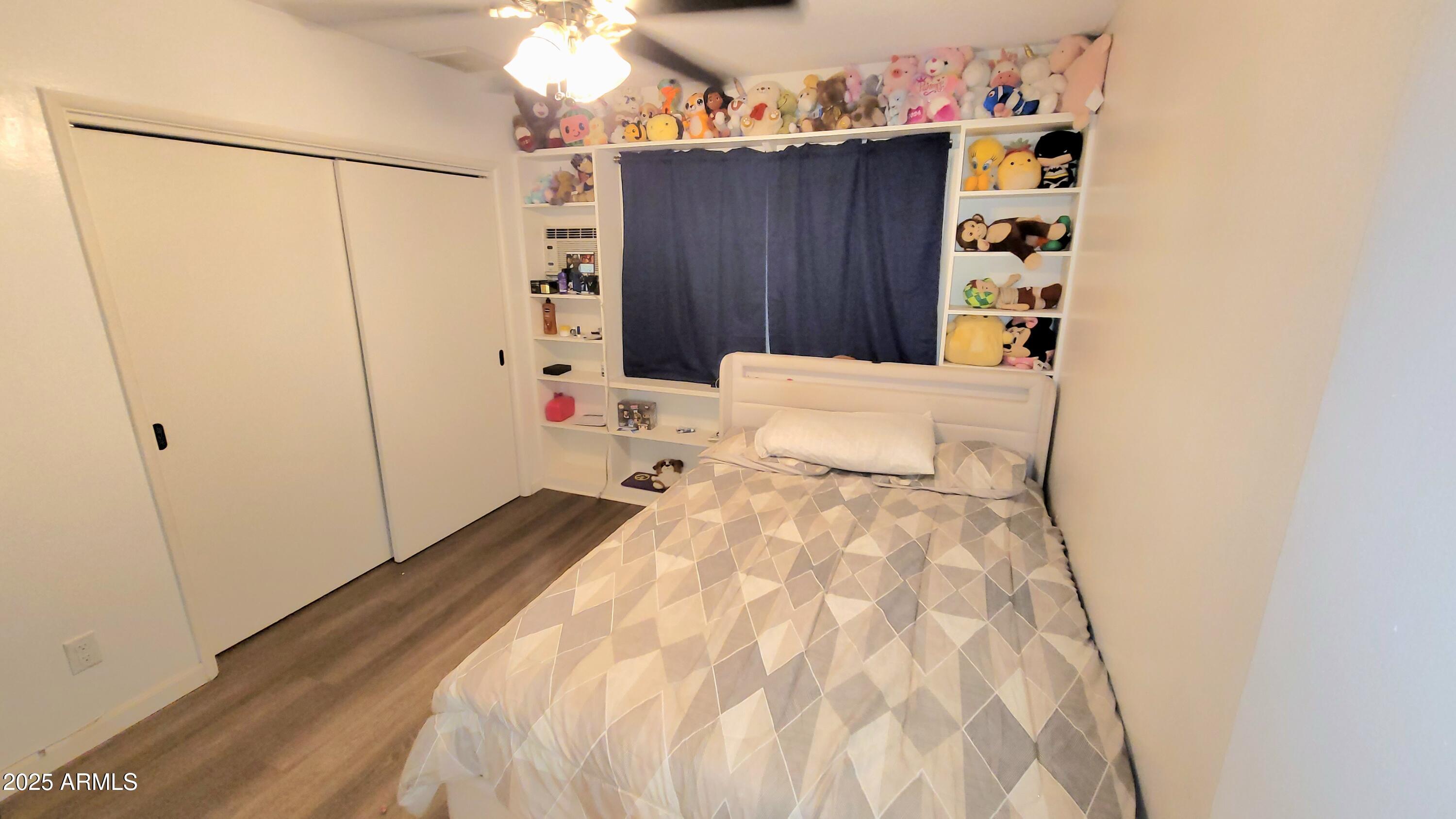 522 South Cortez Road Apache Junction, AZ 85119 - Photo 37 of 48 a bedroom with a bed and a window