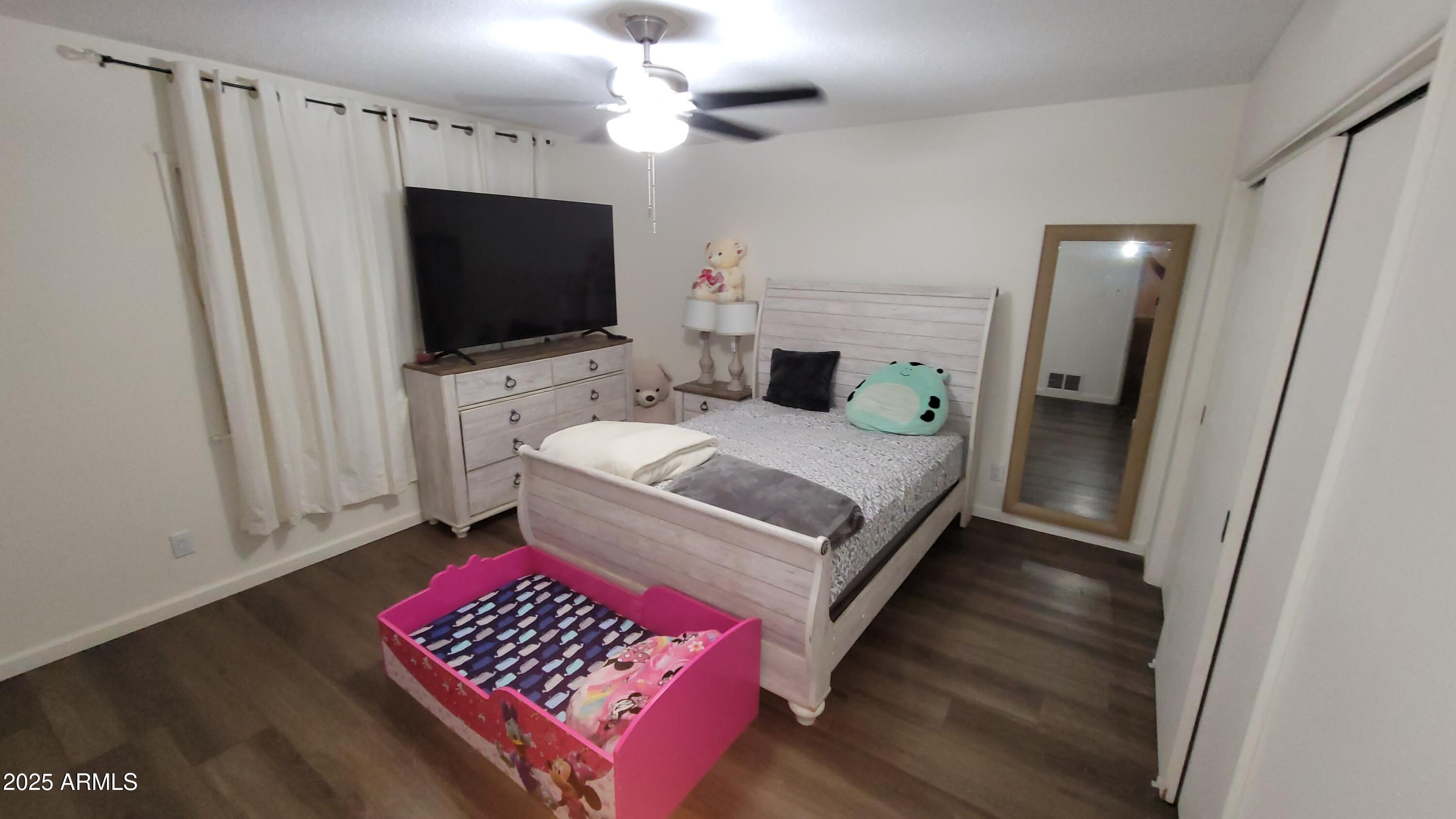 522 South Cortez Road Apache Junction, AZ 85119 - Photo 41 of 48 a living room with furniture and a flat screen tv