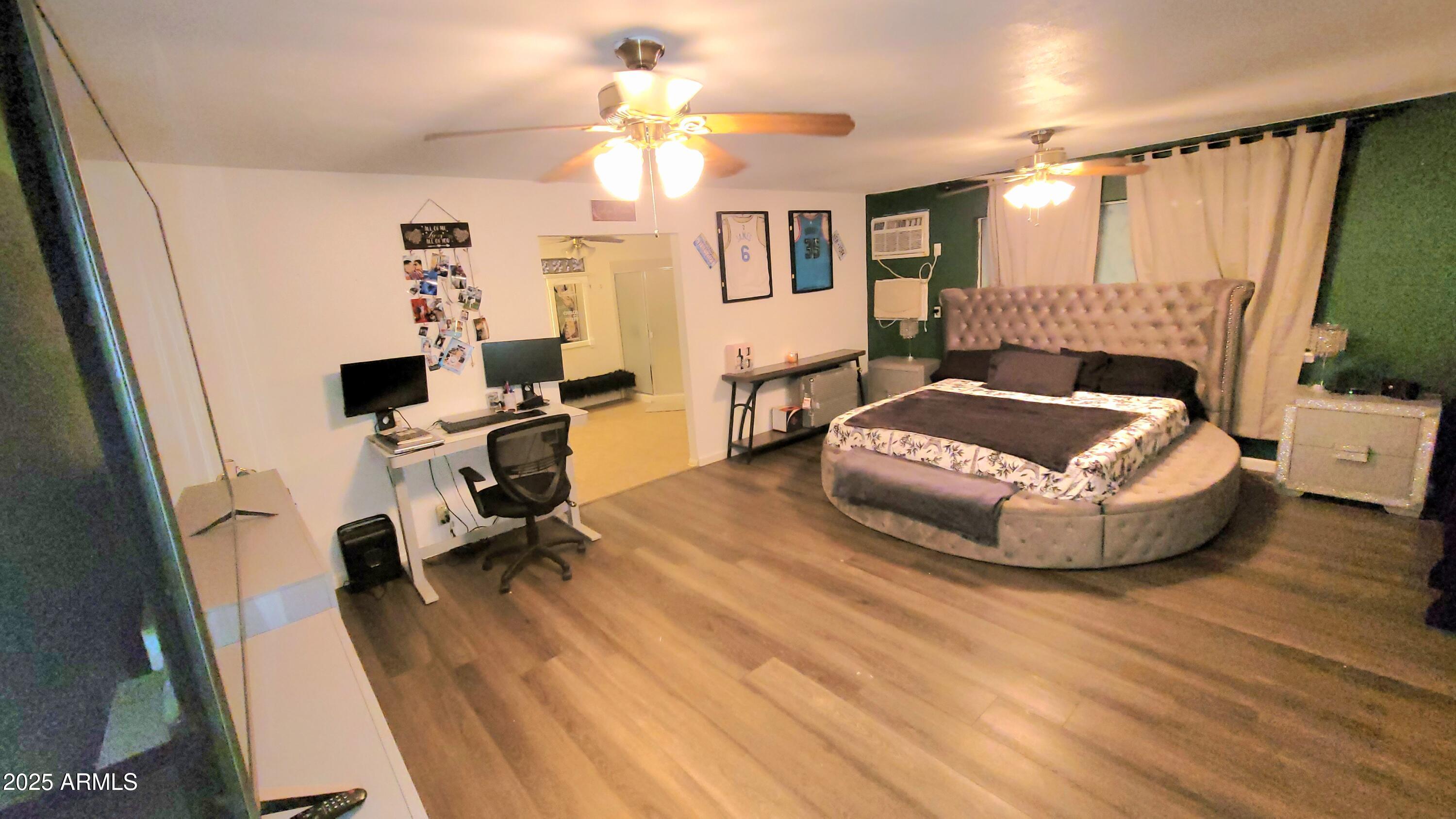 522 South Cortez Road Apache Junction, AZ 85119 - Photo 42 of 48 a living room with furniture and a wooden floor