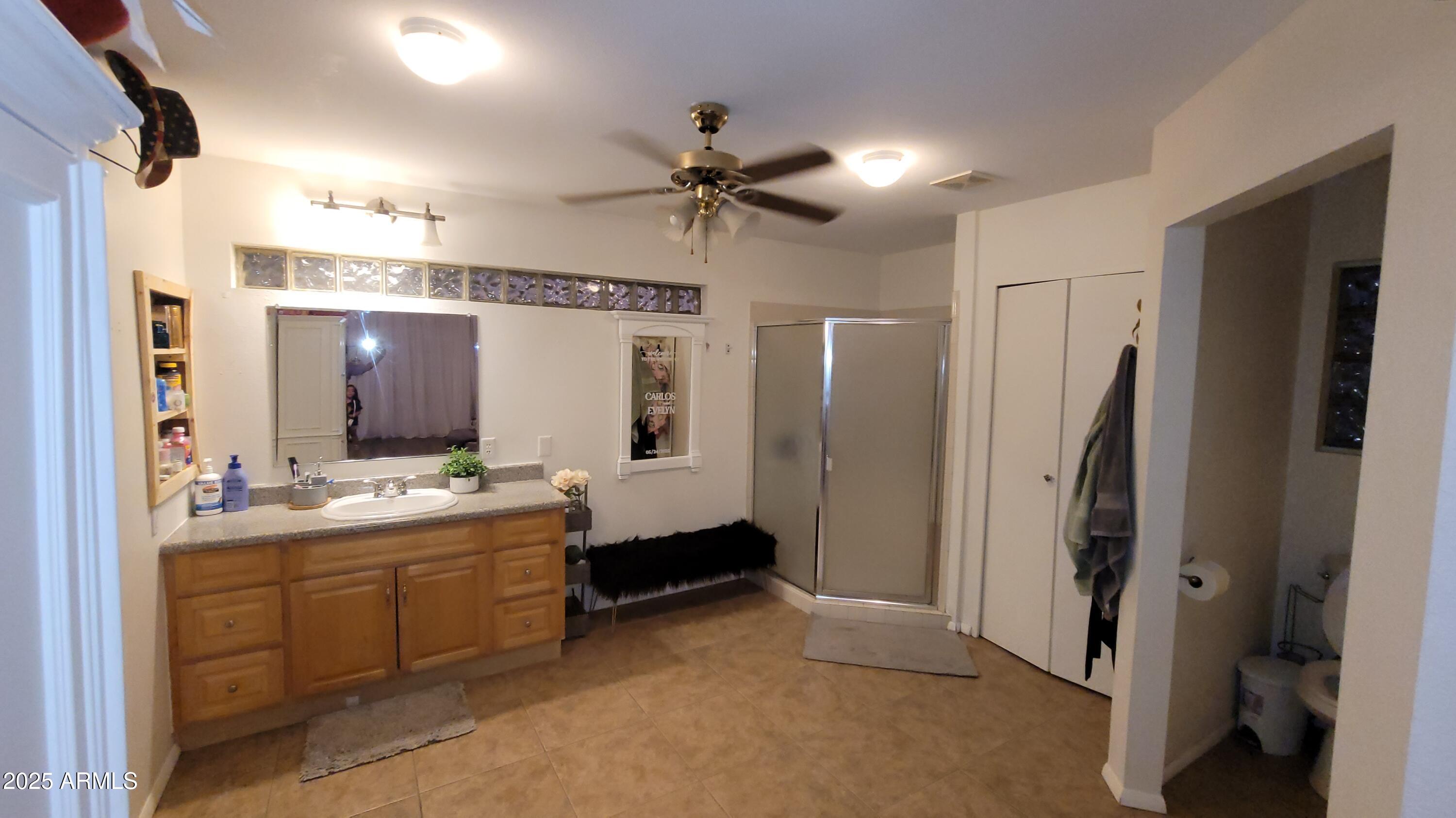 522 South Cortez Road Apache Junction, AZ 85119 - Photo 45 of 48 a bathroom with a double vanity sink mirror and shower