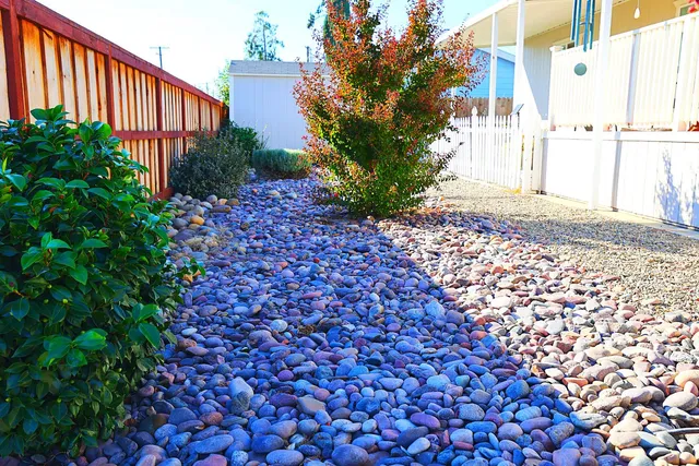 a backyard of a house with a garden