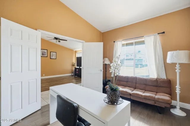 a living room with furniture and a window