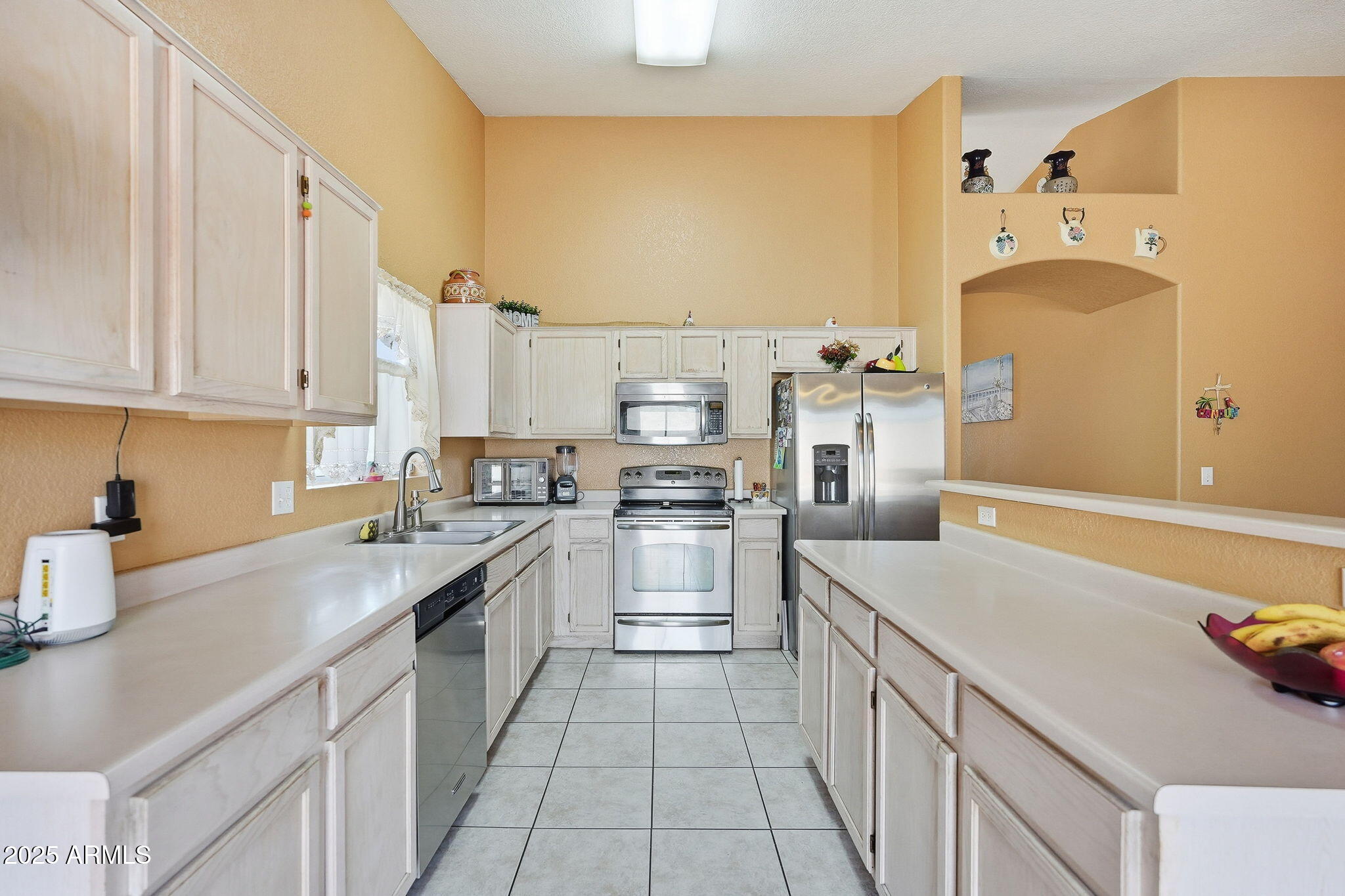 8730 West Ocotillo Road Glendale, AZ 85305 - Photo 14 of 58 a kitchen with a sink stove and cabinets