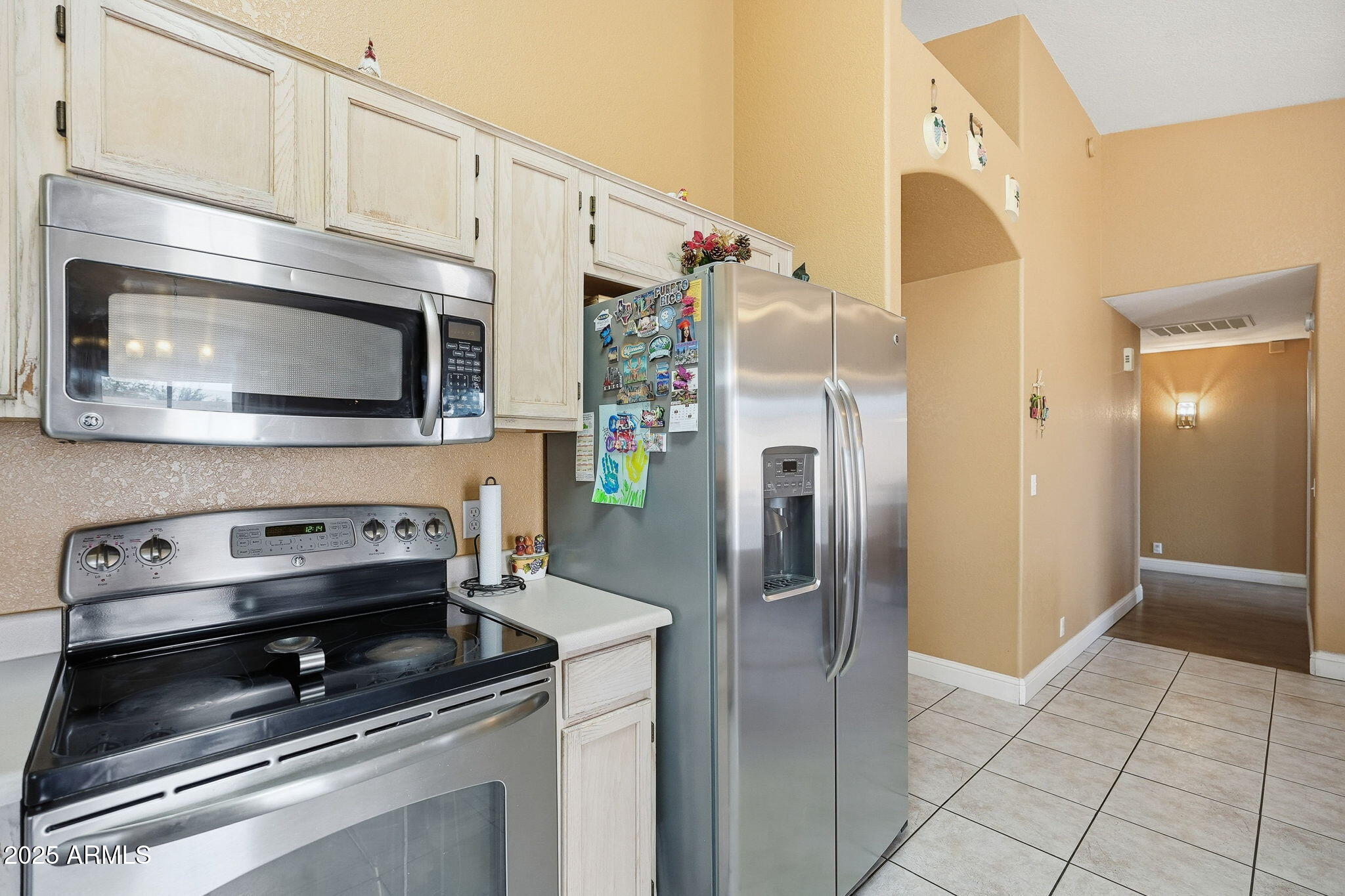 8730 West Ocotillo Road Glendale, AZ 85305 - Photo 18 of 58 a kitchen with granite countertop a stove and a microwave
