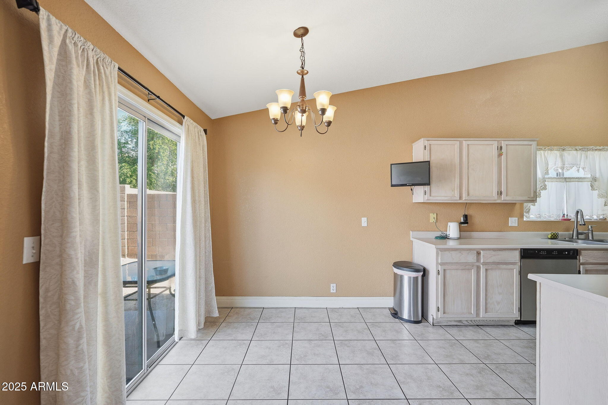 8730 West Ocotillo Road Glendale, AZ 85305 - Photo 21 of 58 a kitchen with a stove a sink and a refrigerator