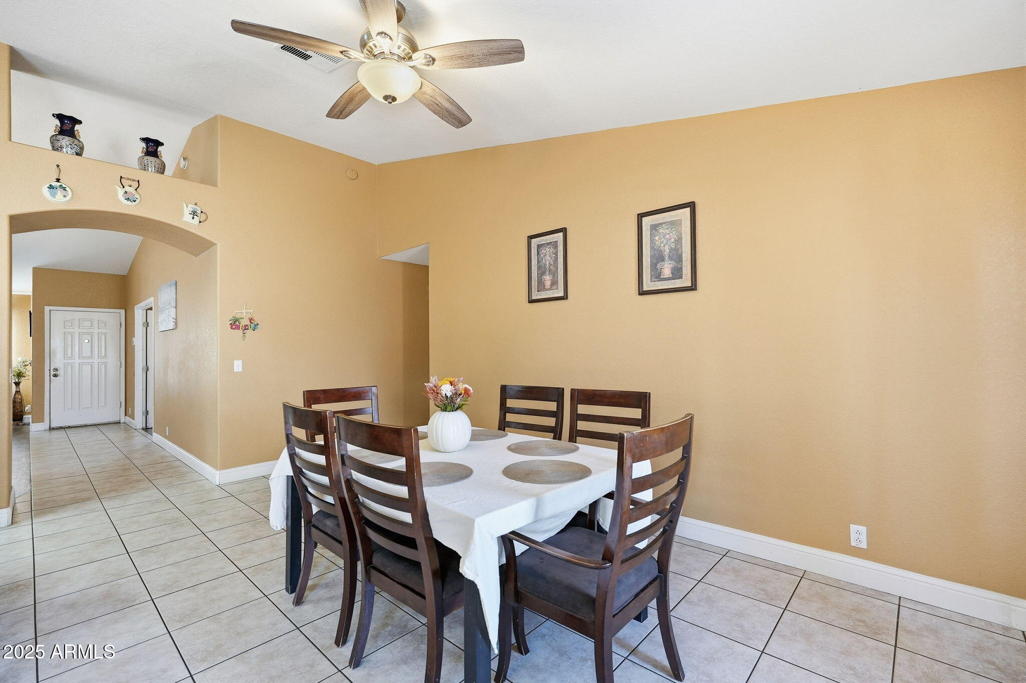 8730 West Ocotillo Road Glendale, AZ 85305 - Photo 24 of 58 a view of a dining room with furniture and chandelier fan