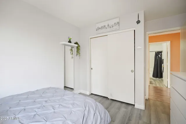 an aerial view of residential houses with outdoor space and parking