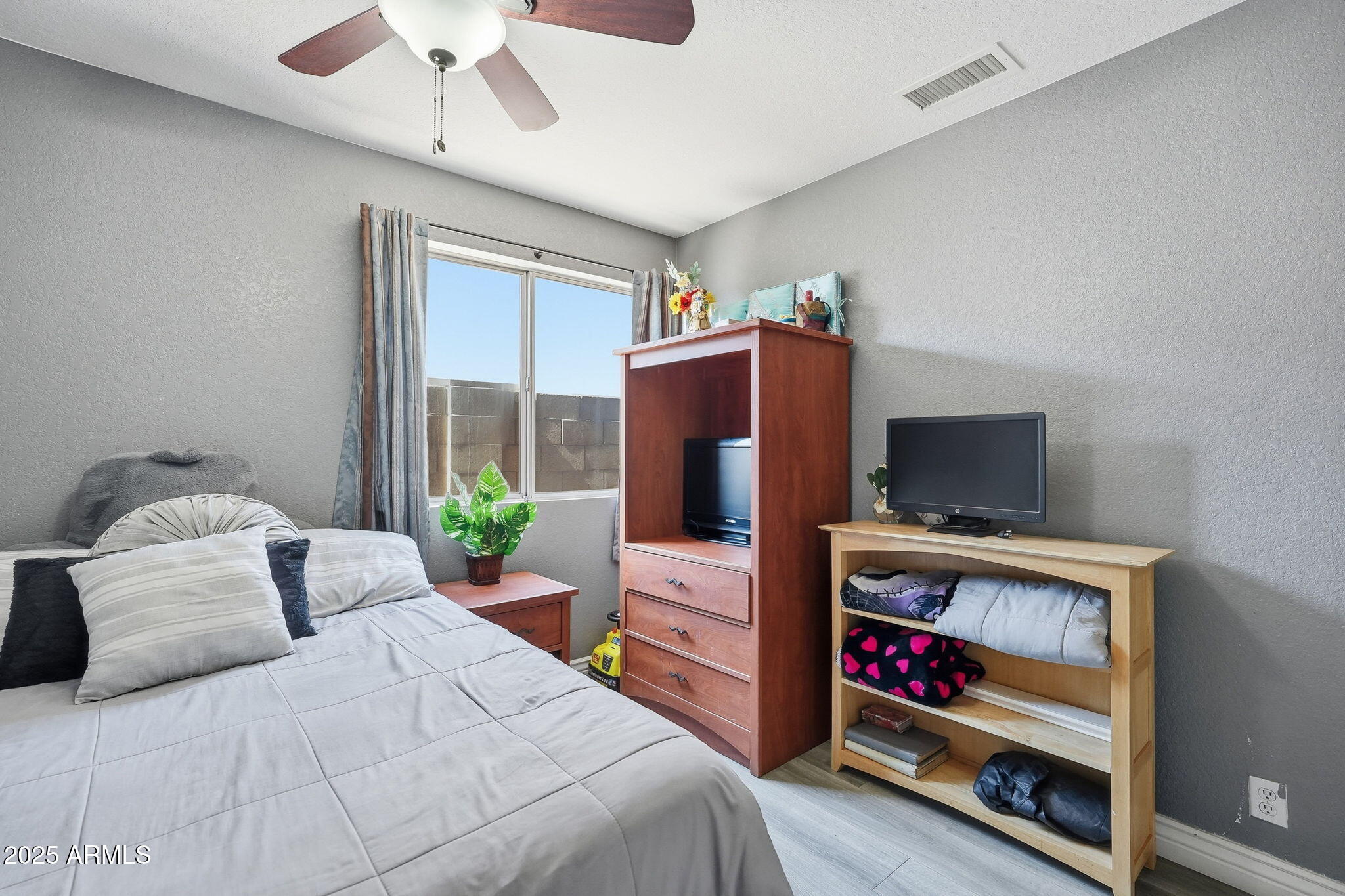 8730 West Ocotillo Road Glendale, AZ 85305 - Photo 39 of 58 a bedroom with a bed and a flat screen tv
