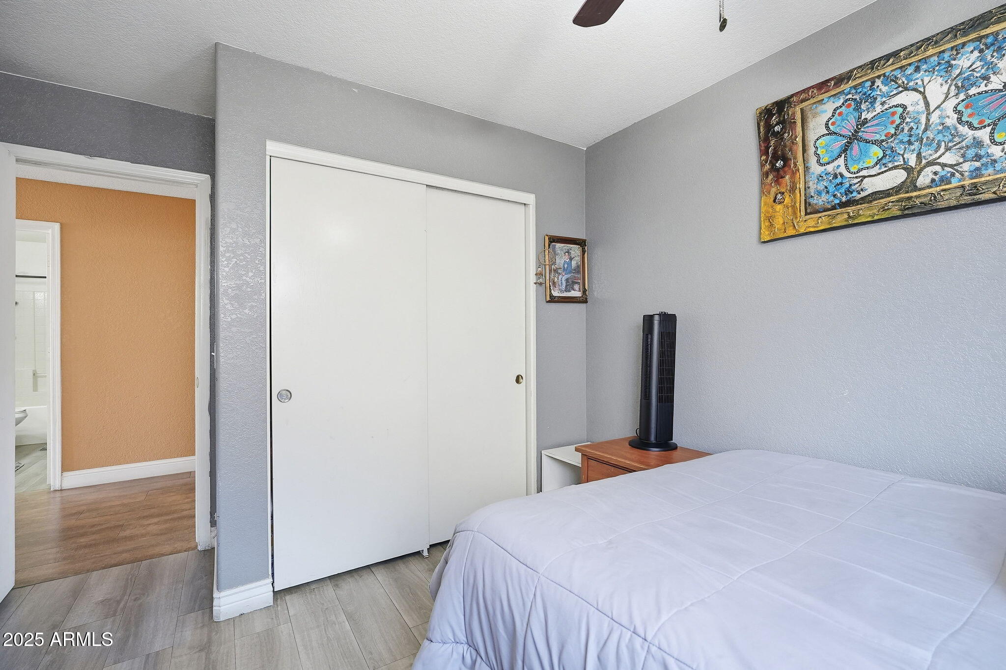 8730 West Ocotillo Road Glendale, AZ 85305 - Photo 40 of 58 a bedroom with a bed and a painting on the wall