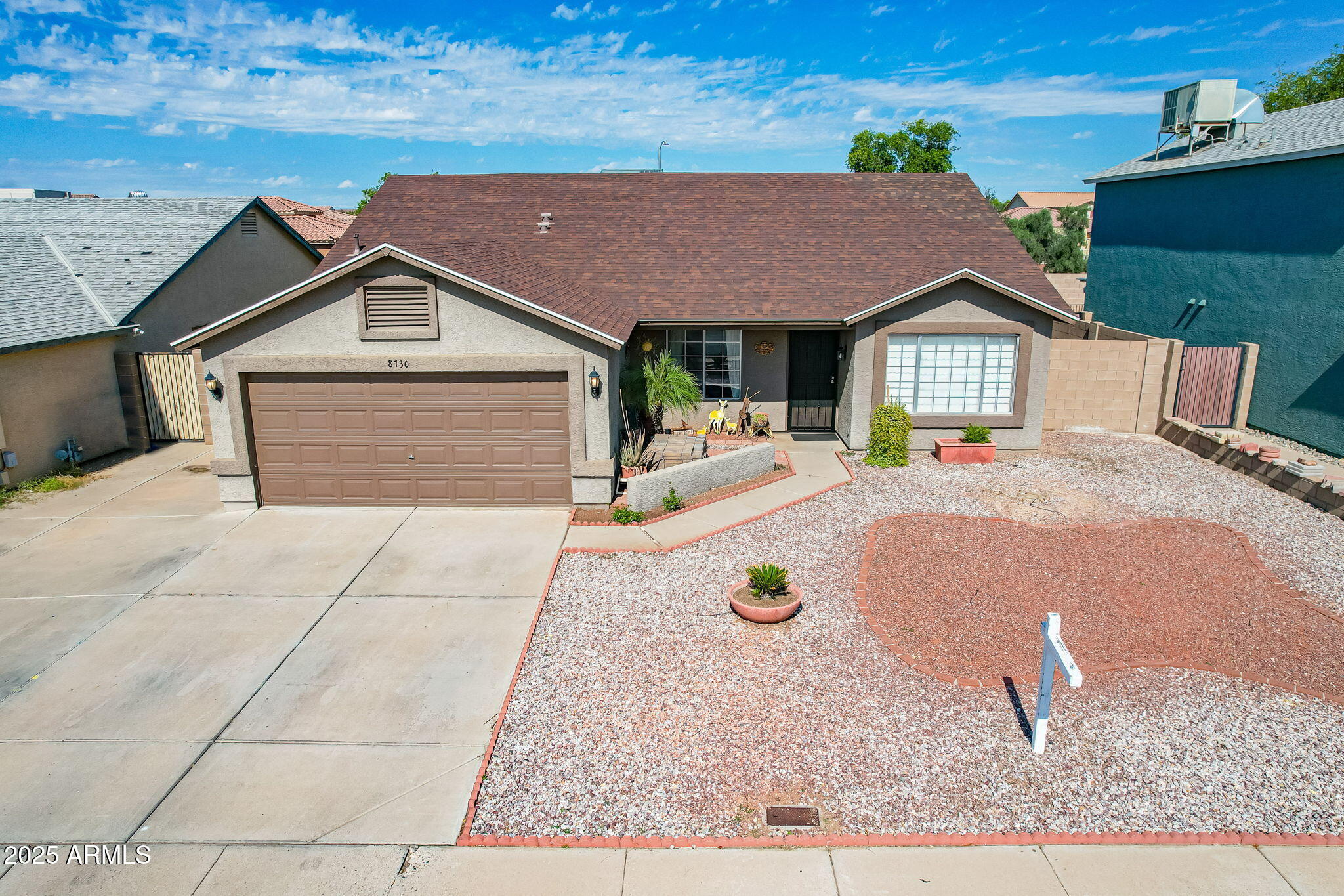 8730 West Ocotillo Road Glendale, AZ 85305 - Photo 47 of 58 a front view of a house with a yard