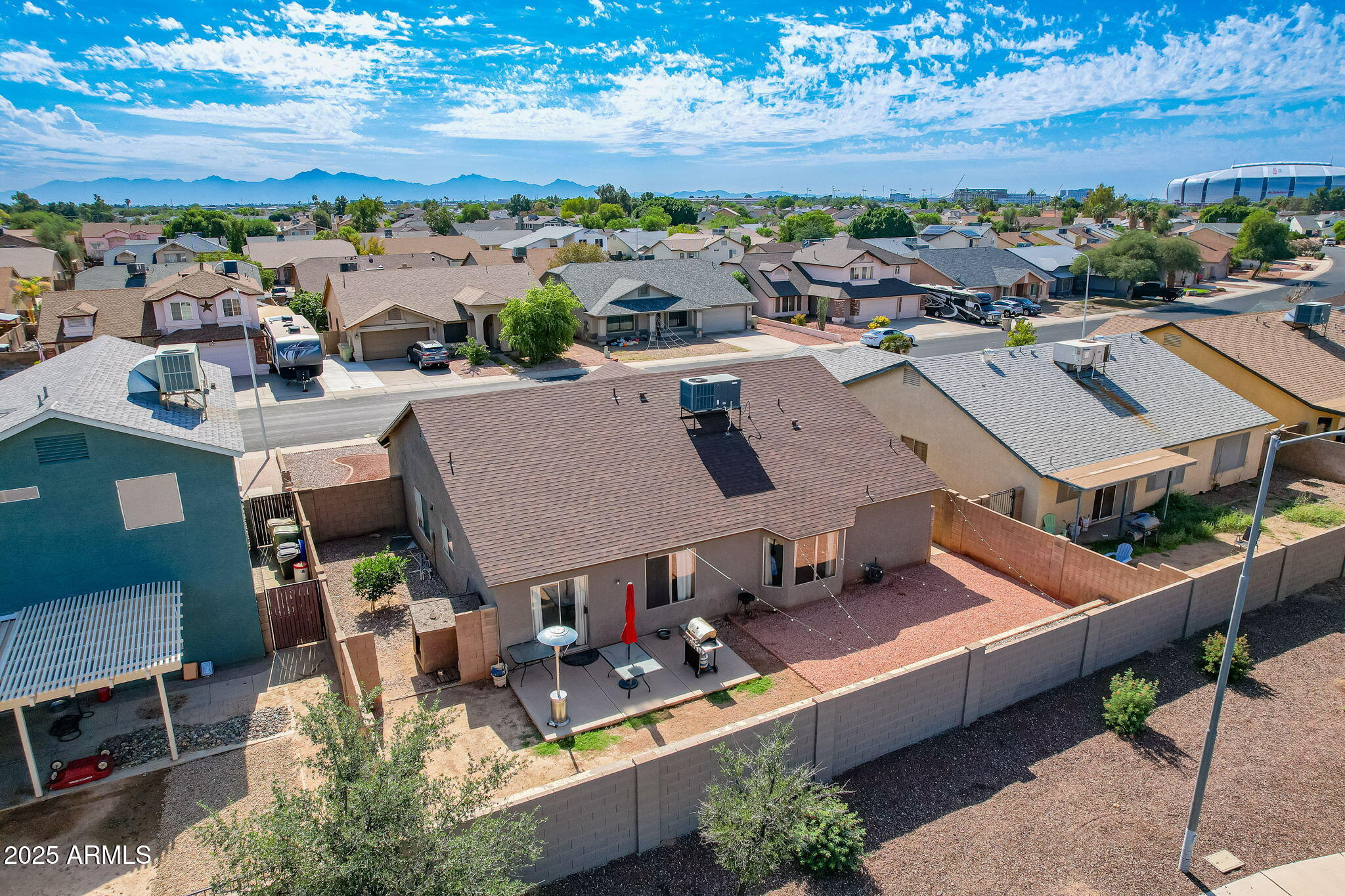 8730 West Ocotillo Road Glendale, AZ 85305 - Photo 49 of 58 an aerial view of a house with a yard lake view and mountain view