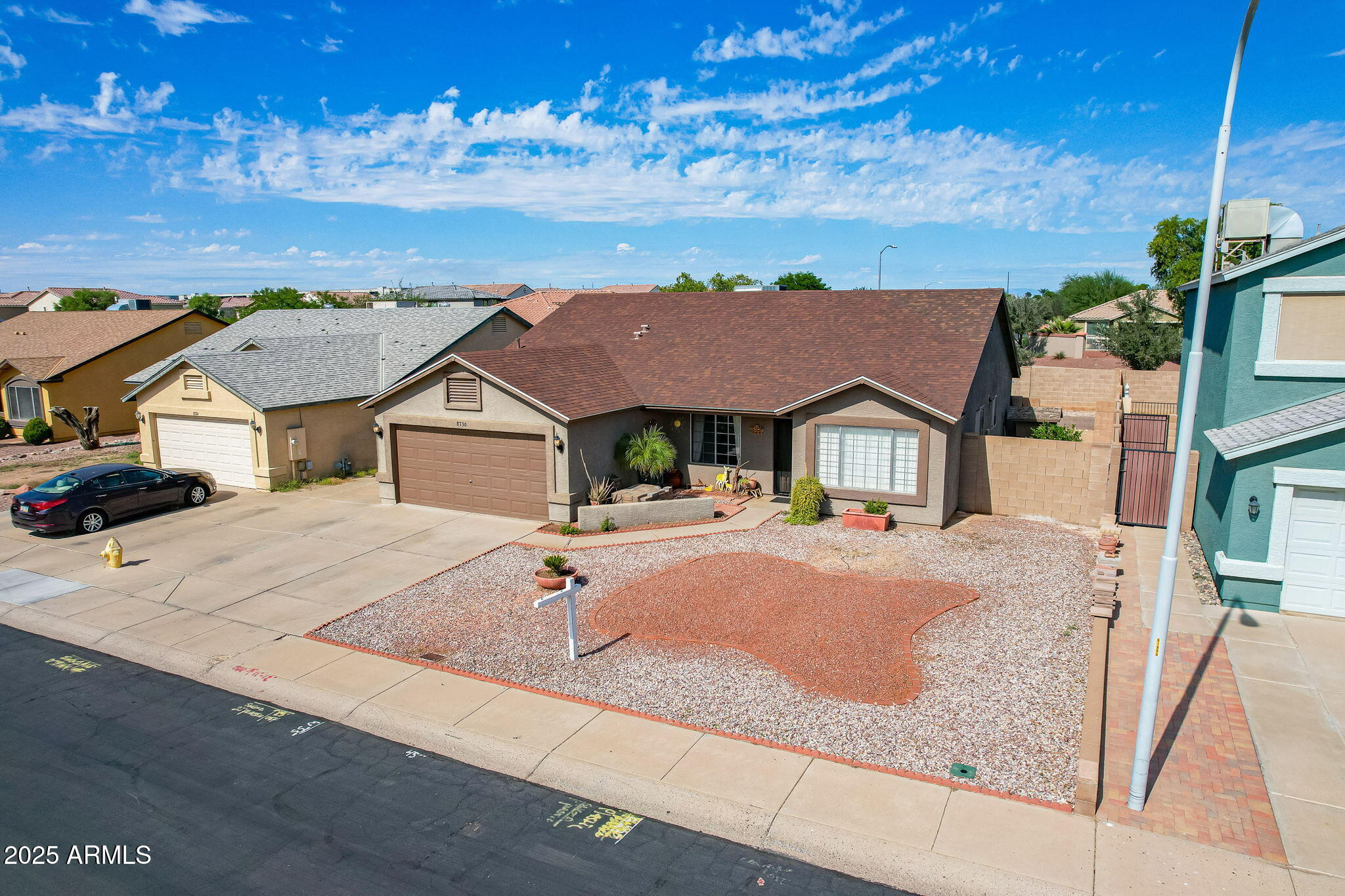 8730 West Ocotillo Road Glendale, AZ 85305 - Photo 57 of 58 a front view of a house with yard and parking