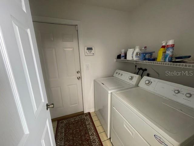 51 Foster Lane Palm Coast, FL 32137 - Photo 4 of 12 a utility room with dryer and washer
