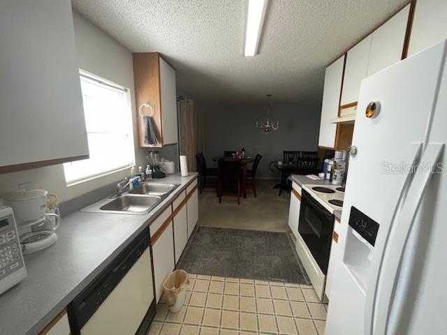 51 Foster Lane Palm Coast, FL 32137 - Photo 5 of 12 a kitchen with granite countertop a sink a counter space and appliances