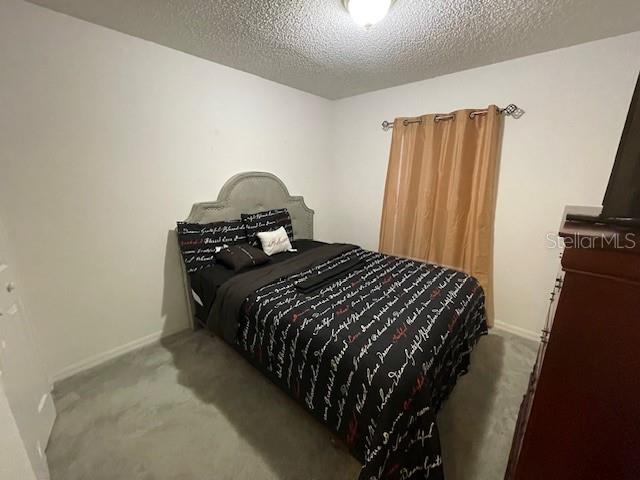 51 Foster Lane Palm Coast, FL 32137 - Photo 8 of 12 a bedroom with a bed and a window